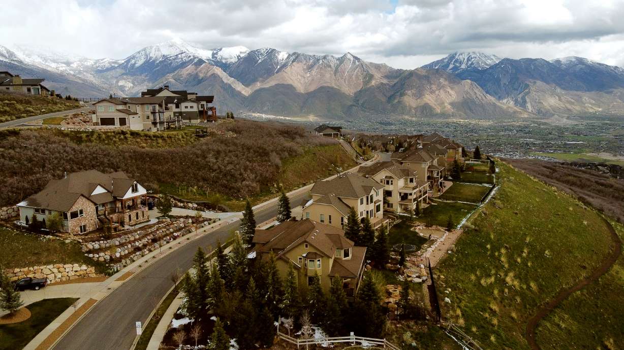 Homes atop Traverse Ridge in Draper are pictured with the Alpine area in the background on May 3. Draper and Holladay leaders are looking at zoning changes to pave the way for more high-density and moderate-income housing.