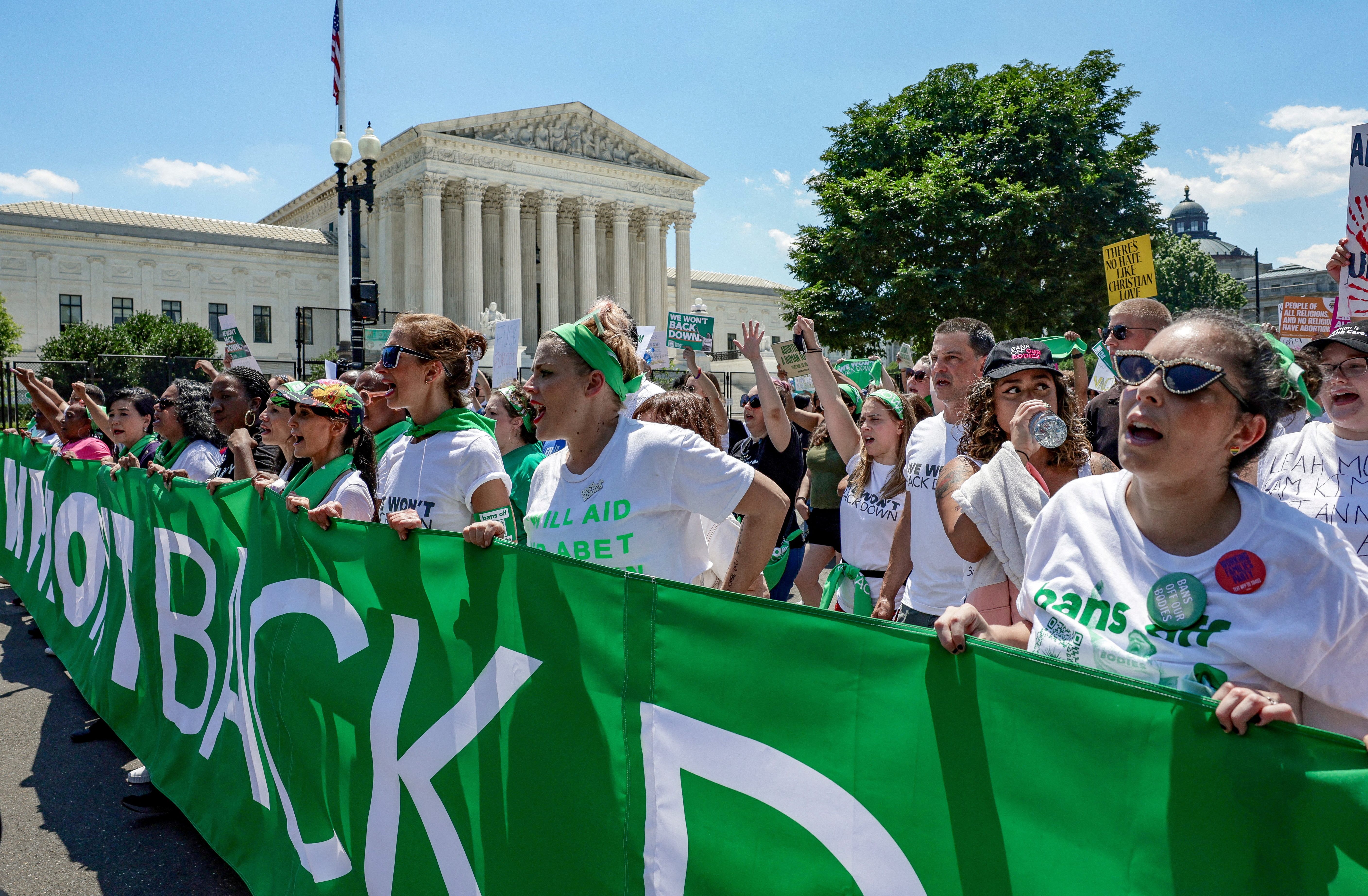Abortion rights activists, including actor Busy Phillips, march past United States Supreme Court to protest the court's ruling to overturn the landmark Roe v. Wade abortion decision, in Washington, on June 30. The Idaho Legislature has asked a federal judge to reconsider his decision blocking the state from enforcing a strict abortion ban in medical emergencies.