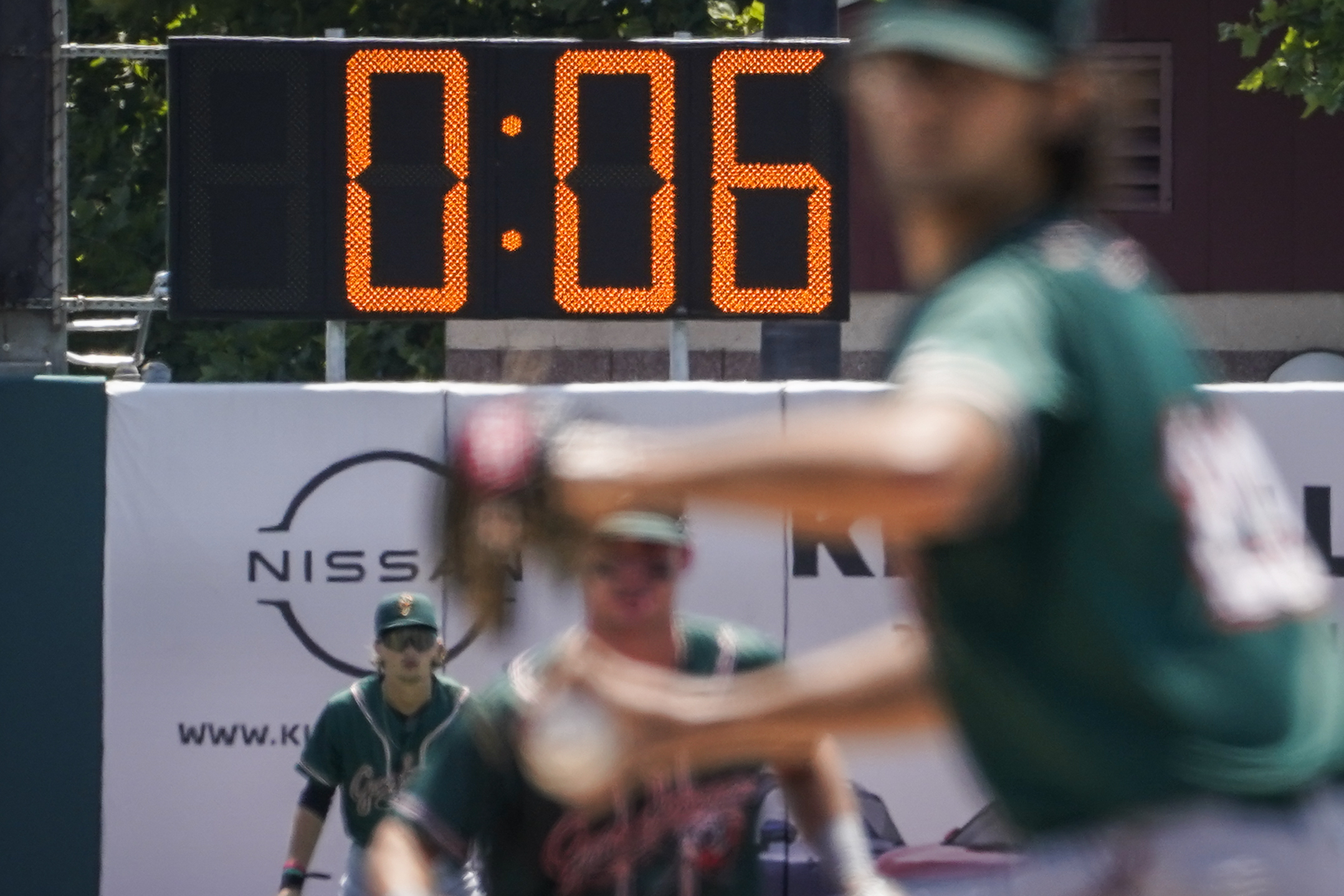 FILE - A pitch clock is deployed to restrict pitcher preparation times during a minor league baseball game between the Brooklyn Cyclones and Greensboro Grasshoppers, July 13, 2022, in the Coney Island neighborhood of the Brooklyn borough of New York. Major League Baseball is set to announce a pitch clock and limits on defensive shifts next season in an effort to shorten games and increase offense. The sport’s 11-man competition committee is set to adopt the rules changes Friday, Sept. 9.