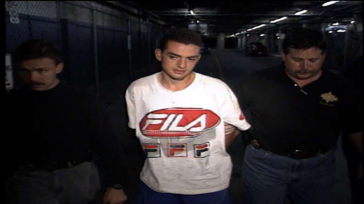 Salt Lake County sheriff's detectives Kris Ownby, left and Keith Stephens arrest 19-year-old Jorge Benvenuto in 1996.