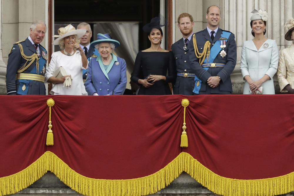 In this July 10, 2018, photo, members of the royal family gather on the balcony of Buckingham Palace, with from left, Prince Charles, Camilla the Duchess of Cornwall, Prince Andrew, Queen Elizabeth II, Meghan the Duchess of Sussex, Prince Harry, Prince William and Kate the Duchess of Cambridge, as they watch a flyby of Royal Air Force aircraft pass over Buckingham Palace in London.