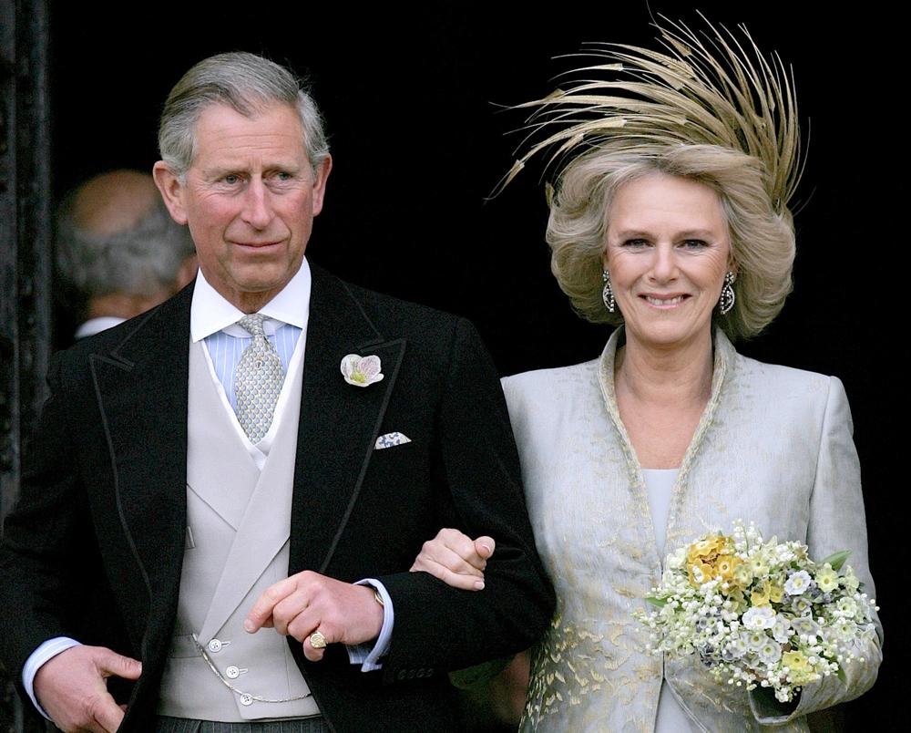 In this April 9, 2005, photo, Britain's Prince Charles and his bride Camilla Duchess of Cornwall leave St George's Chapel in Windsor, England following the church blessing of their civil wedding ceremony.
