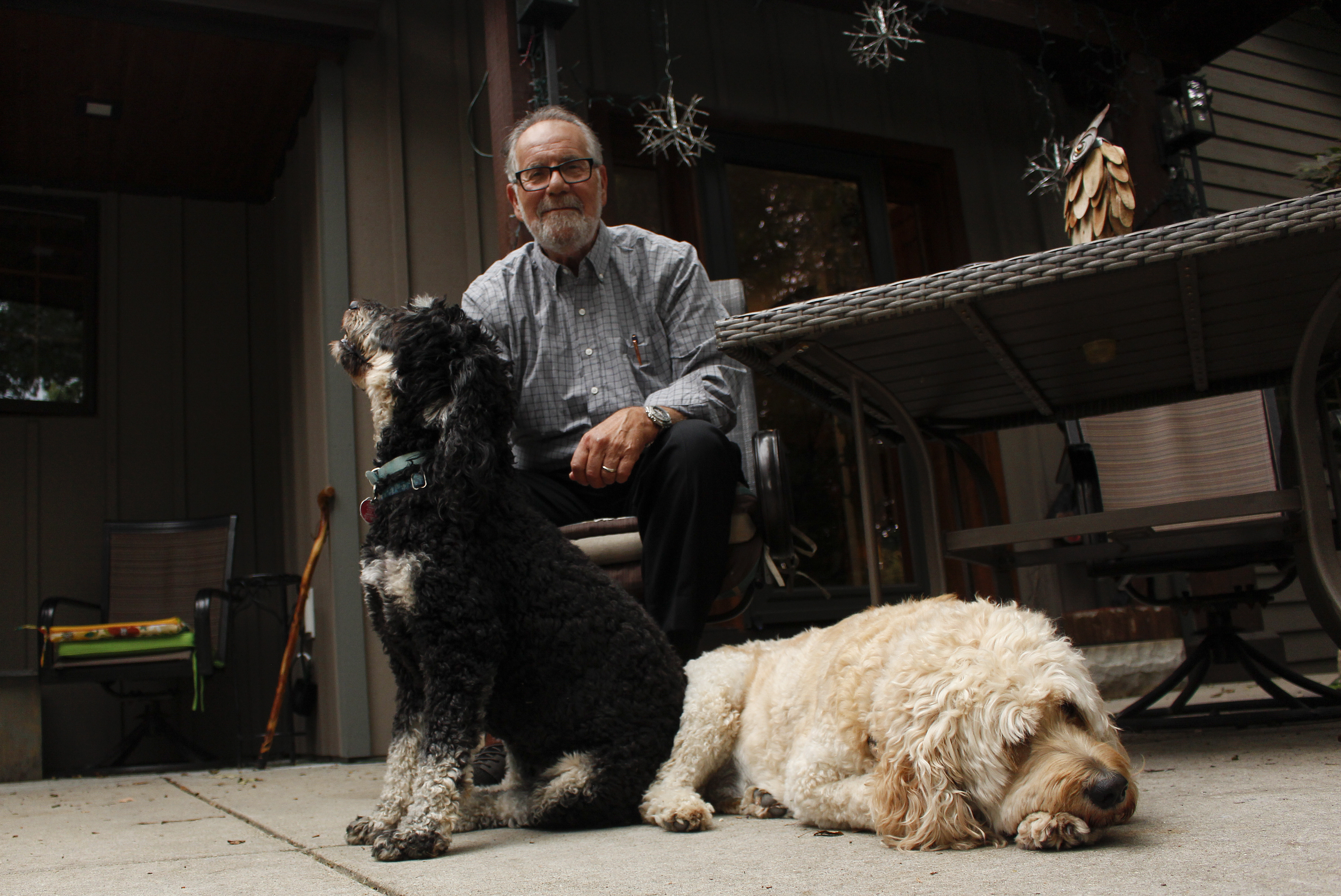 Gordon Haberman sits with his two dogs, Sept. 6, in West Bend, Wis. His daughter Andrea Haberman died in the Sept. 11, 2001, attacks in New York.