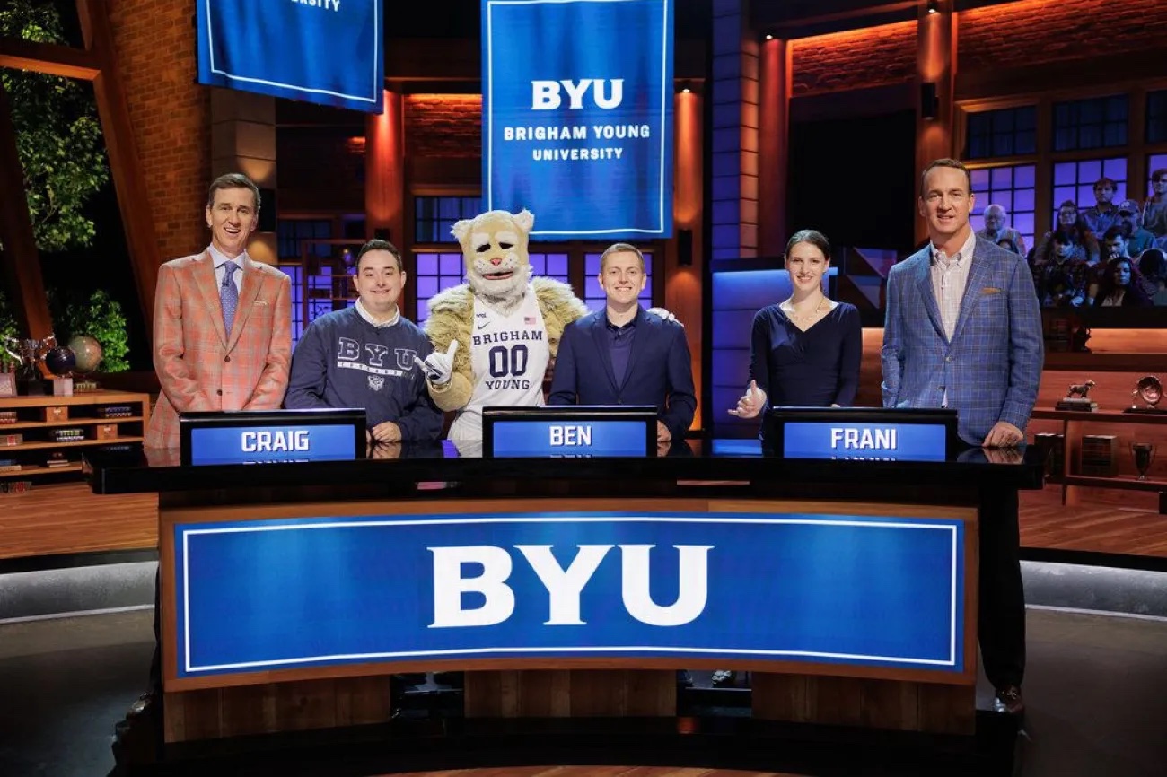 Cooper Manning, Craig Walker, Cosmo the Cougar, Ben Potter, Frani King and Peyton Manning on the set of “College Bowl.”