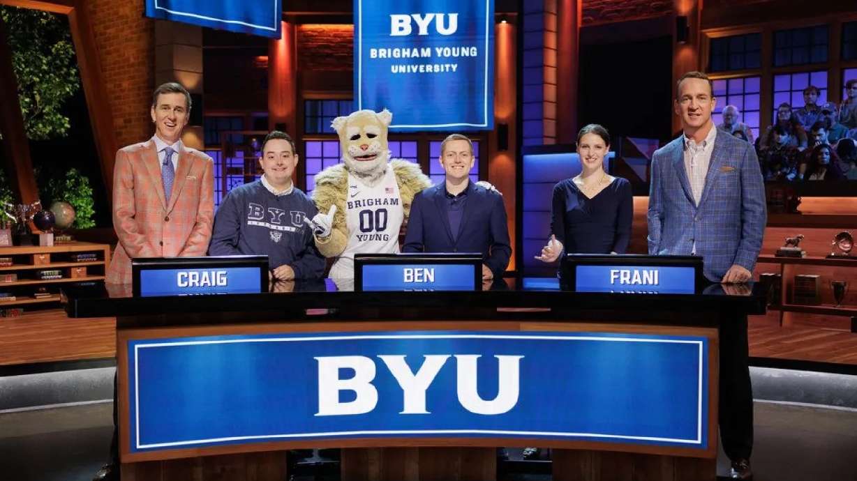 Cooper Manning, Craig Walker, Cosmo the Cougar, Ben Potter, Frani King and Peyton Manning on the set of “College Bowl.”