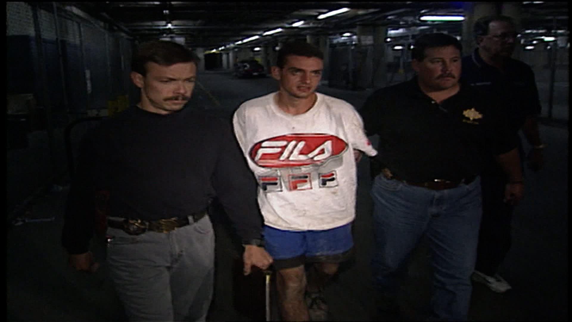 Salt Lake County sheriff's detectives Kris Ownby, left and Keith Stephens arrest 19-year-old Jorge Benvenuto in 1996.