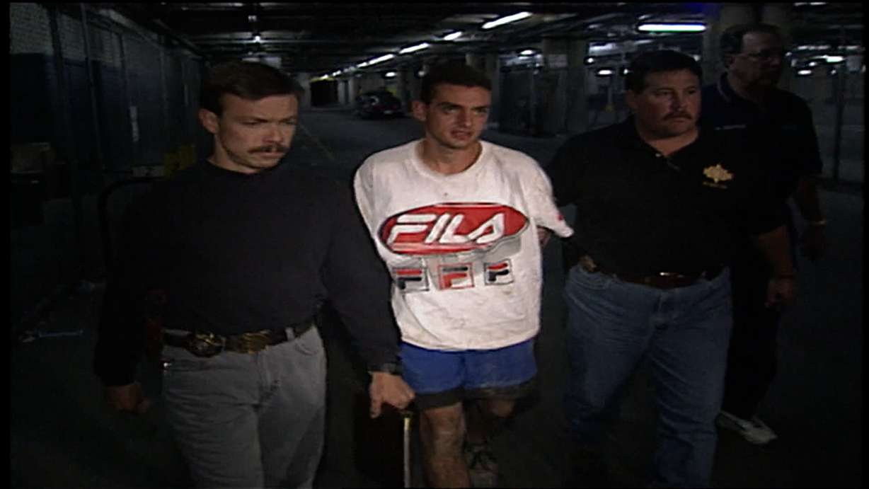 Salt Lake County sheriff's detectives Kris Ownby, left and Keith Stephens arrest 19-year-old Jorge Benvenuto in 1996.