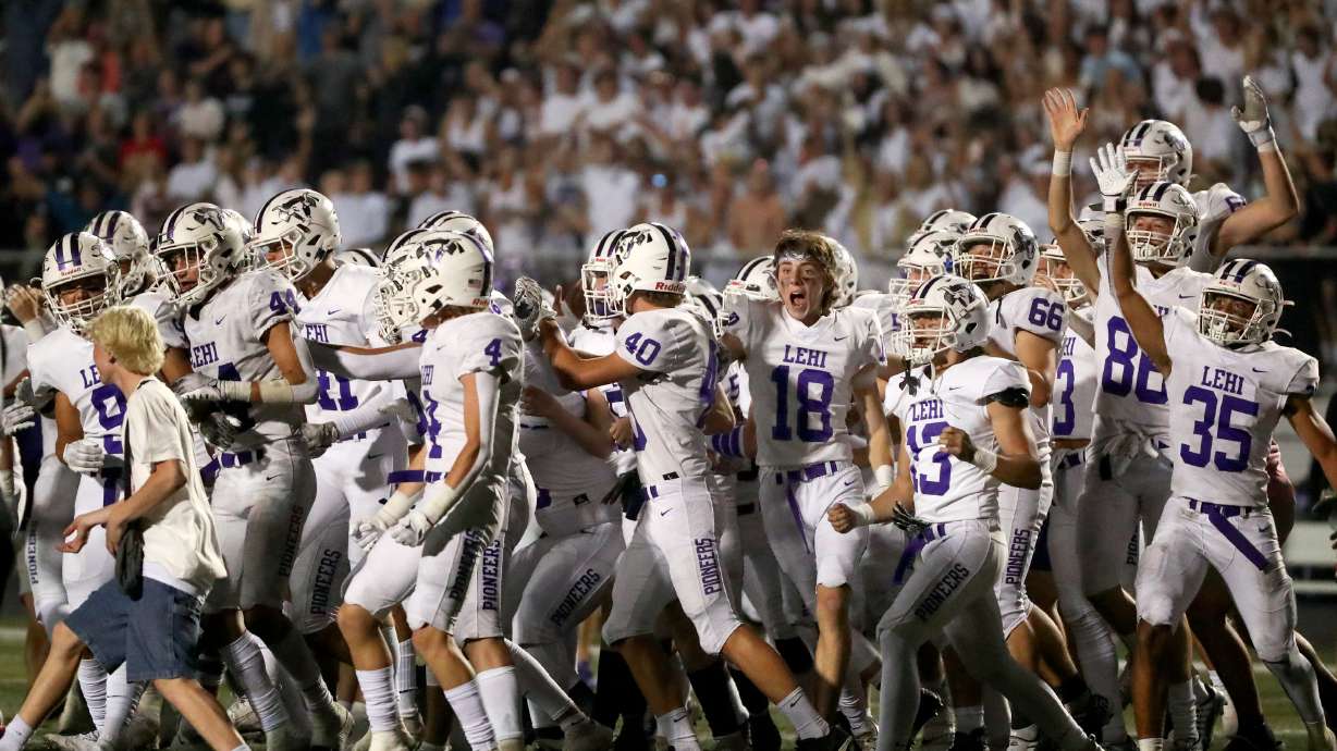 Lehi celebrates winning a varsity football game against Corner Canyon at Corner Canyon High School in Draper on Friday, Sept. 9, 2022. Lehi won 25-24.