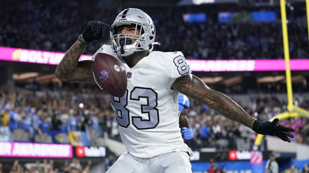 FILE - Las Vegas Raiders' Darren Waller reacts after scoring a touchdown during the second half of an NFL football game against the Los Angeles Chargers, Monday, Oct. 4, 2021, in Inglewood, Calif. Raiders star tight end Darren Waller has hired new agents as he hopes to get a new contract before the start of the season. Waller cut ties with Klutch Sports last week after less than a year with that agency and signed Wednesday, Aug. 31, 2022, with Drew Rosenhaus and Robert Bailey .