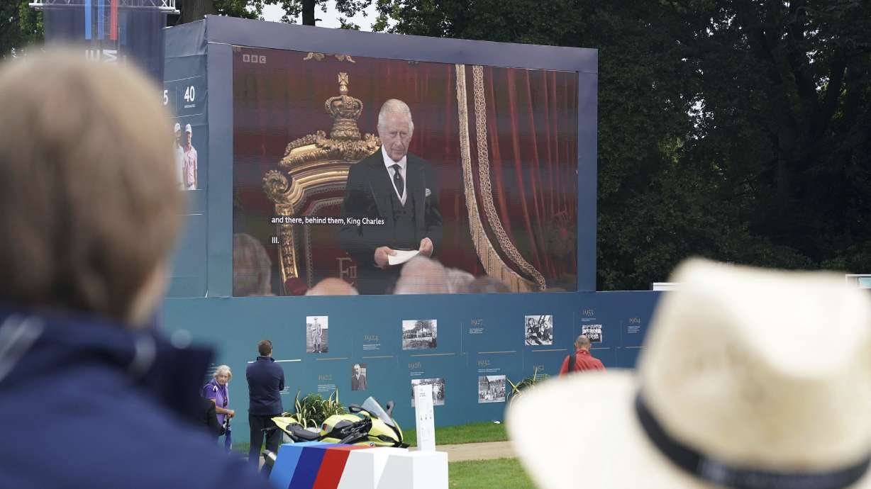Spectators watch the Accession Council, where King Charles III is formally proclaimed monarch, on the big screen at Wentworth Golf Club, Virginia Water, Britain, Saturday, Sept. 10, 2022.