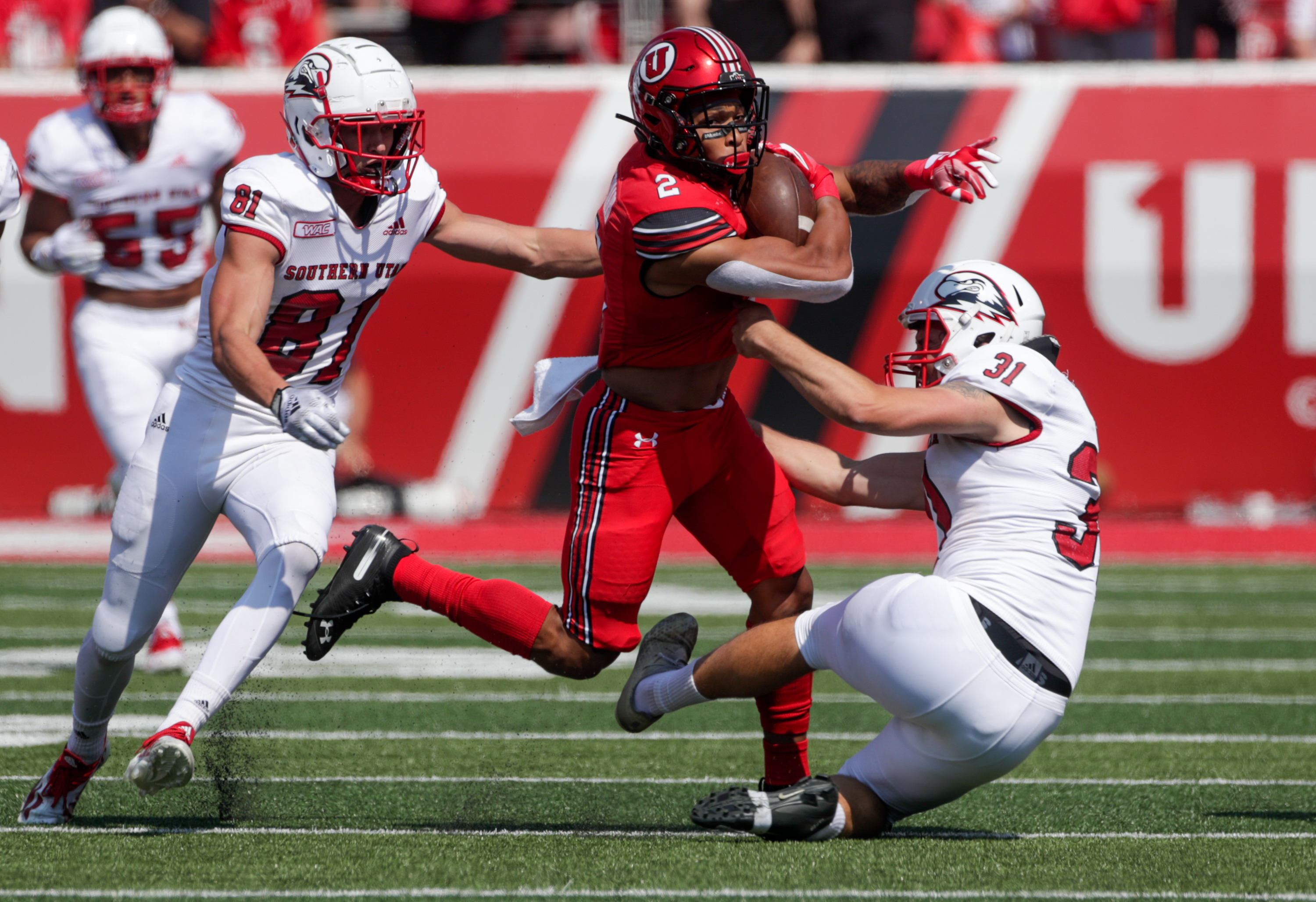 Micah Bernad (2) of The Utah Utes returns the ball for 44-yards and is tackled by Brennon Hutchings (81) and Jake Gerardi (31) of the Southern Utah Thunderbirds in Salt Lake City on Saturday, Sept. 10, 2022.