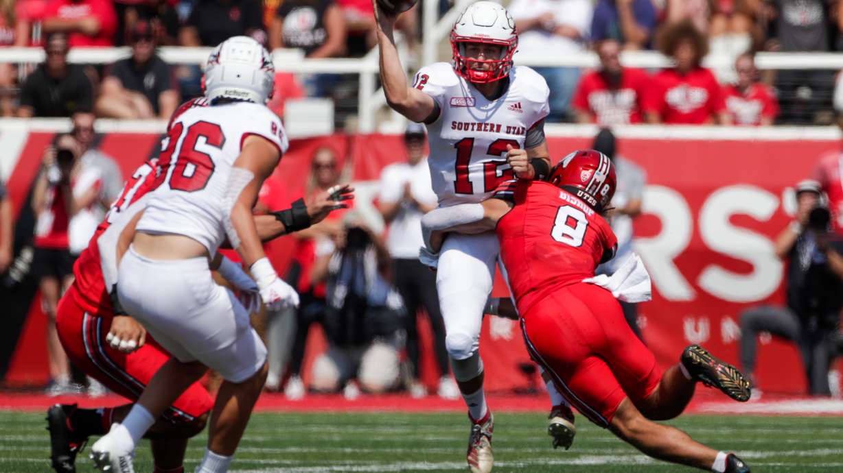 Justin Miller (12) of the Southern Utah Thunderbirds is tackled by Cole Bishop (8) of The Utah Utes in Salt Lake City on Saturday, Sept. 10, 2022.