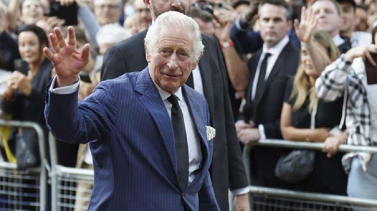 King Charles III greets members of the public outside Clarence House in London after he was formally proclaimed monarch by the Privy Council, Saturday.
