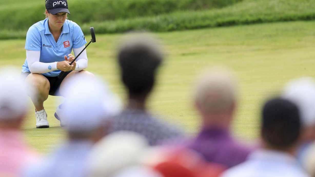 Ally Ewing lines up a putt on the 13th green during the third round of the LPGA Tour Kroger Queen City Championship golf tournament in Cincinnati, Saturday, Sept. 10, 2022.