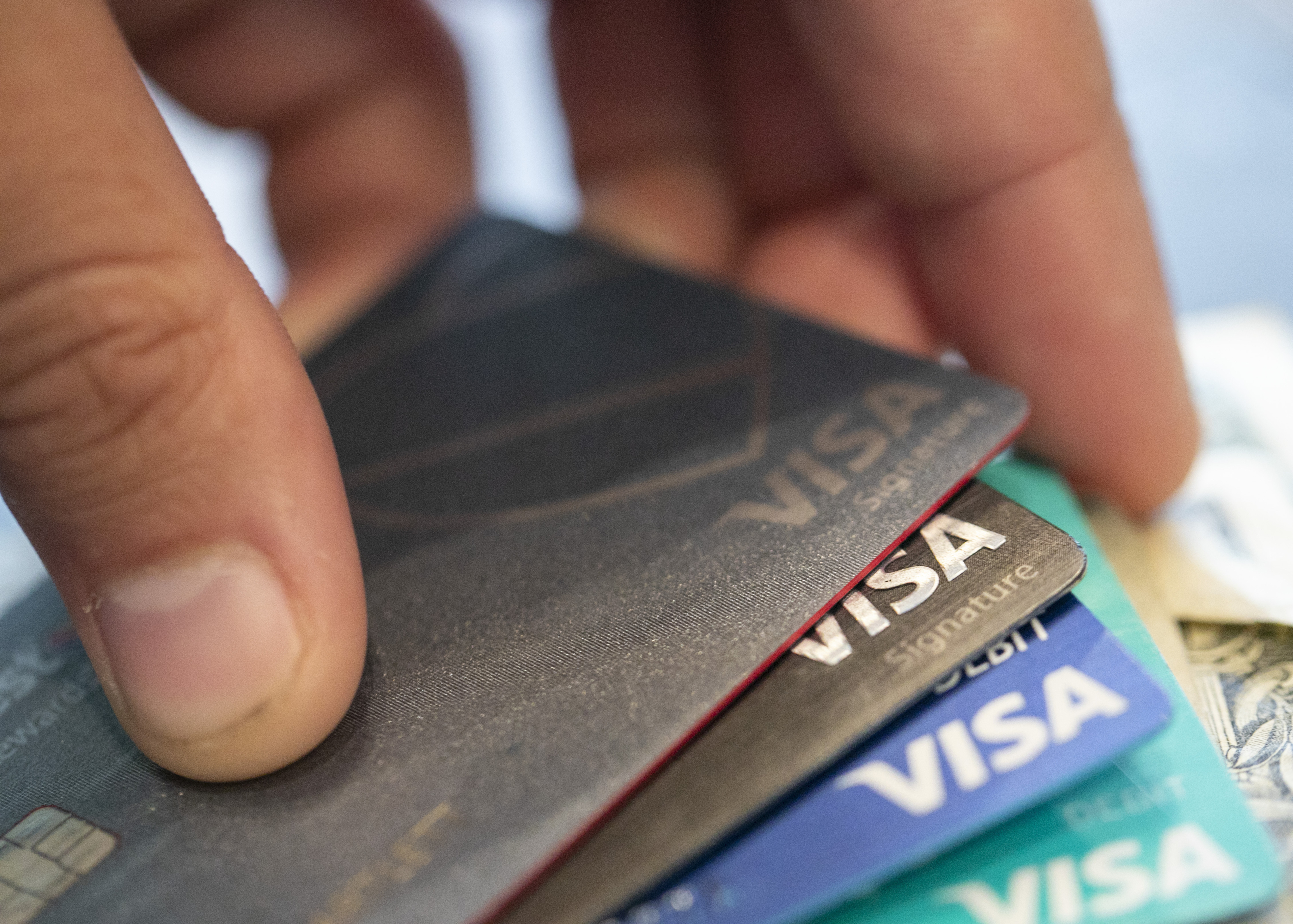 Visa credit cards are seen on Aug. 11, 2019, in New Orleans. Payment processor Visa Inc. said late Saturday that it plans to start separately categorizing sales at gun shops. 