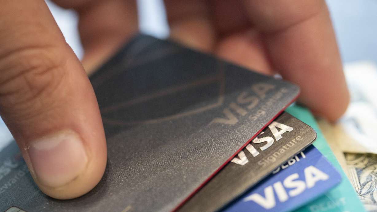 Visa credit cards are seen on Aug. 11, 2019, in New Orleans. Payment processor Visa Inc. said late Saturday that it plans to start separately categorizing sales at gun shops.