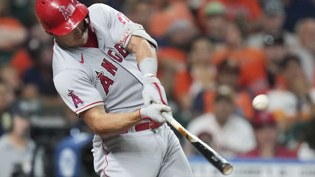 Los Angeles Angels' Mike Trout hits a three-run home run during the second inning of the team's baseball game against the Houston Astros, Saturday, Sept. 10, 2022, in Houston.