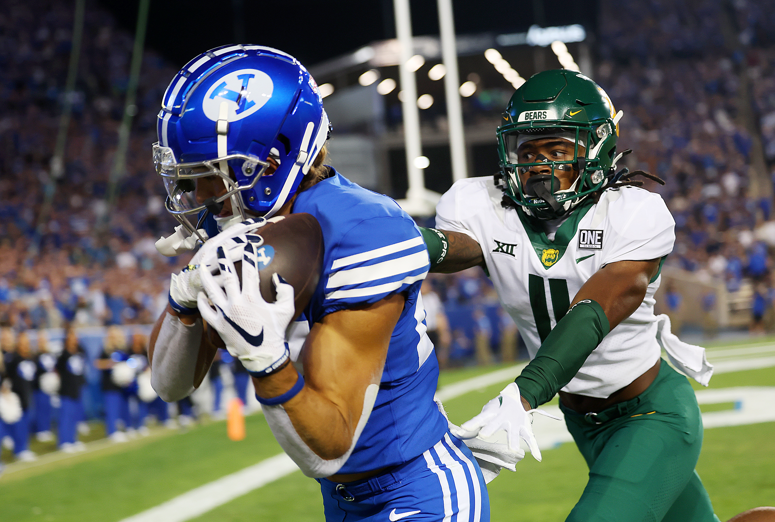 Brigham Young Cougars wide receiver Chase Roberts (27) makes a touchdown catch in the corner of the end zone ahead of Baylor Bears cornerback Lorando Johnson (11) as BYU and Baylor play at LaVell Edwards Stadium in Provo on Saturday, Sept. 10, 2022.