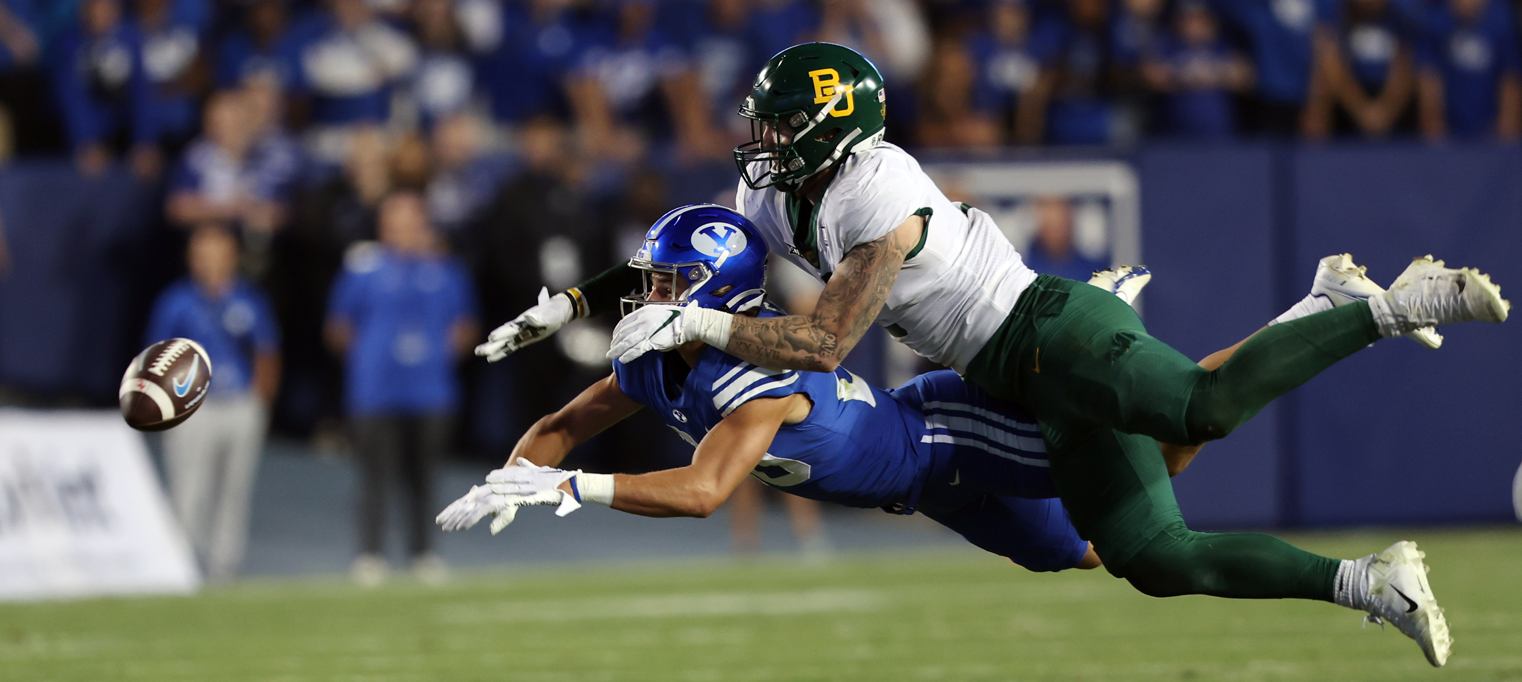 Baylor Bears linebacker Matt Jones (2) is hit with pass interference as he defends Brigham Young Cougars wide receiver Brayden Cosper (20) as BYU and Baylor play at LaVell Edwards Stadium in Provo on Saturday, Sept. 10, 2022.