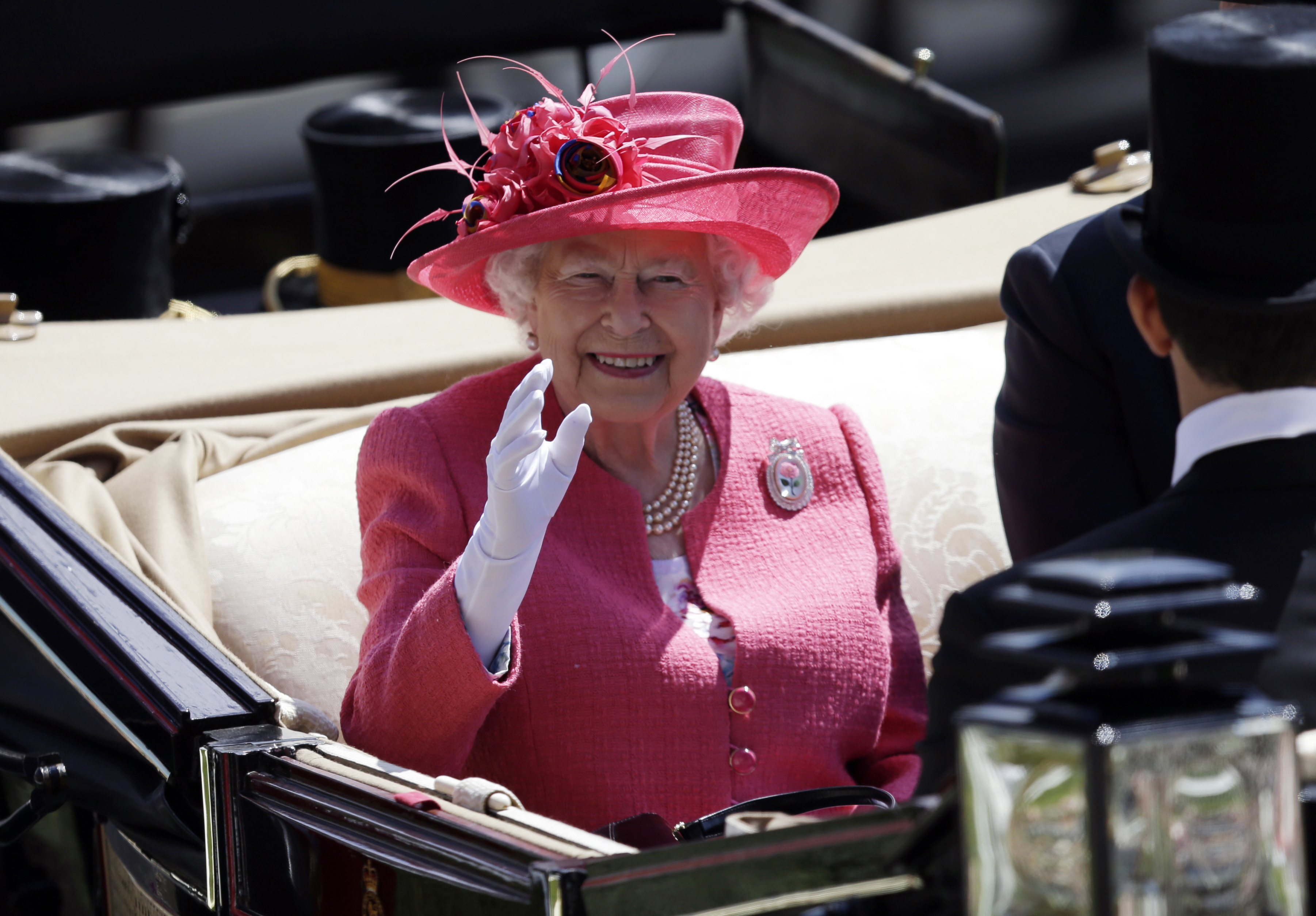 FILE - Britain's Queen Elizabeth II arrives on the third day of the Royal Ascot horse race meeting, which is traditionally known as Ladies Day, in Ascot, England, Thursday, June 21, 2018. Horse racing was Queen Elizabeth II's big sporting love. She first rode a horse at the age of 3 and would inherit the breeding and racing stock of her father, King George VI, when she acceded to the throne in 1952.