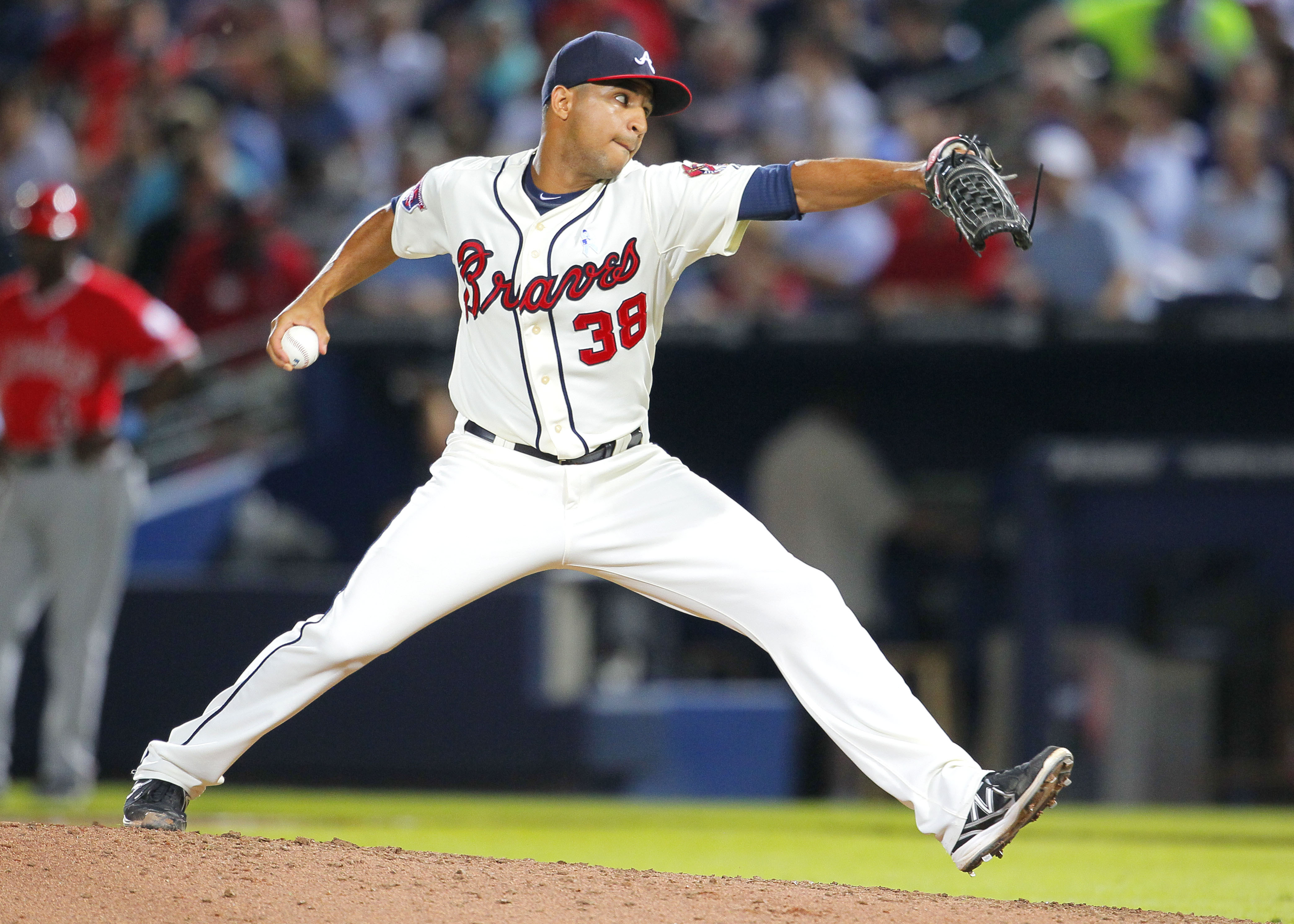 FILE - Atlanta Braves relief pitcher Anthony Varvaro delivers in the sixth inning of a baseball game against the Los Angeles Angels on June 15, 2014, in Atlanta. Varvaro, a former MLB pitcher who retired in 2016 to become a police officer in the New York City area, was killed in a car accident Sunday, Sept. 11, 2022, on his way to work at the Sept. 11 memorial ceremony in Manhattan, according to police officials and his former teams. 