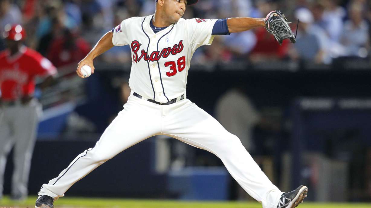 FILE - Atlanta Braves relief pitcher Anthony Varvaro delivers in the sixth inning of a baseball game against the Los Angeles Angels on June 15, 2014, in Atlanta. Varvaro, a former MLB pitcher who retired in 2016 to become a police officer in the New York City area, was killed in a car accident Sunday, Sept. 11, 2022, on his way to work at the Sept. 11 memorial ceremony in Manhattan, according to police officials and his former teams.