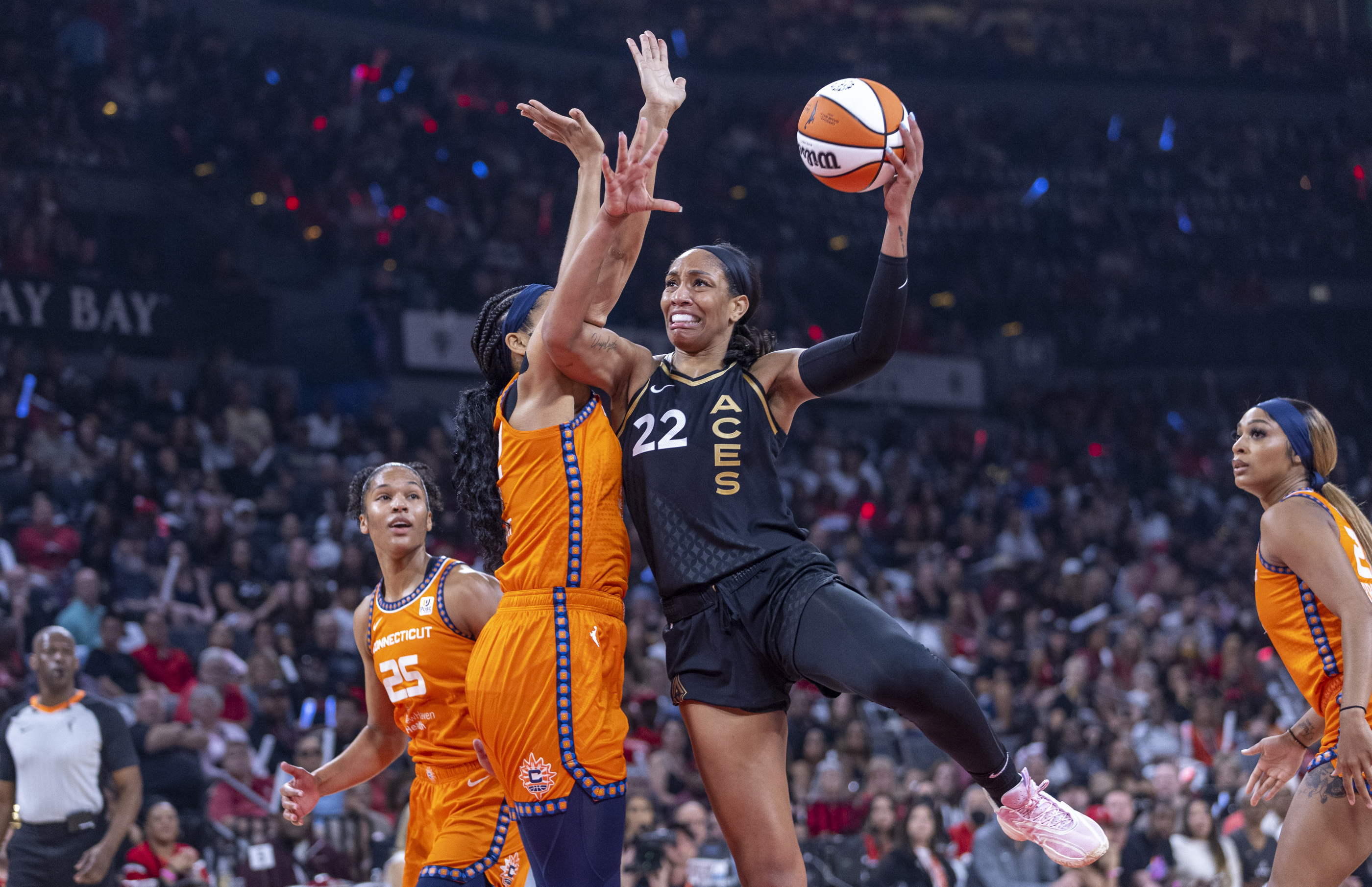 Las Vegas Aces forward A'ja Wilson (22) posts up for a shot over Connecticut Sun center Brionna Jones during the first half in Game 1 of a WNBA basketball final playoff series Sunday, Sept. 11, 2022, in Las Vegas.