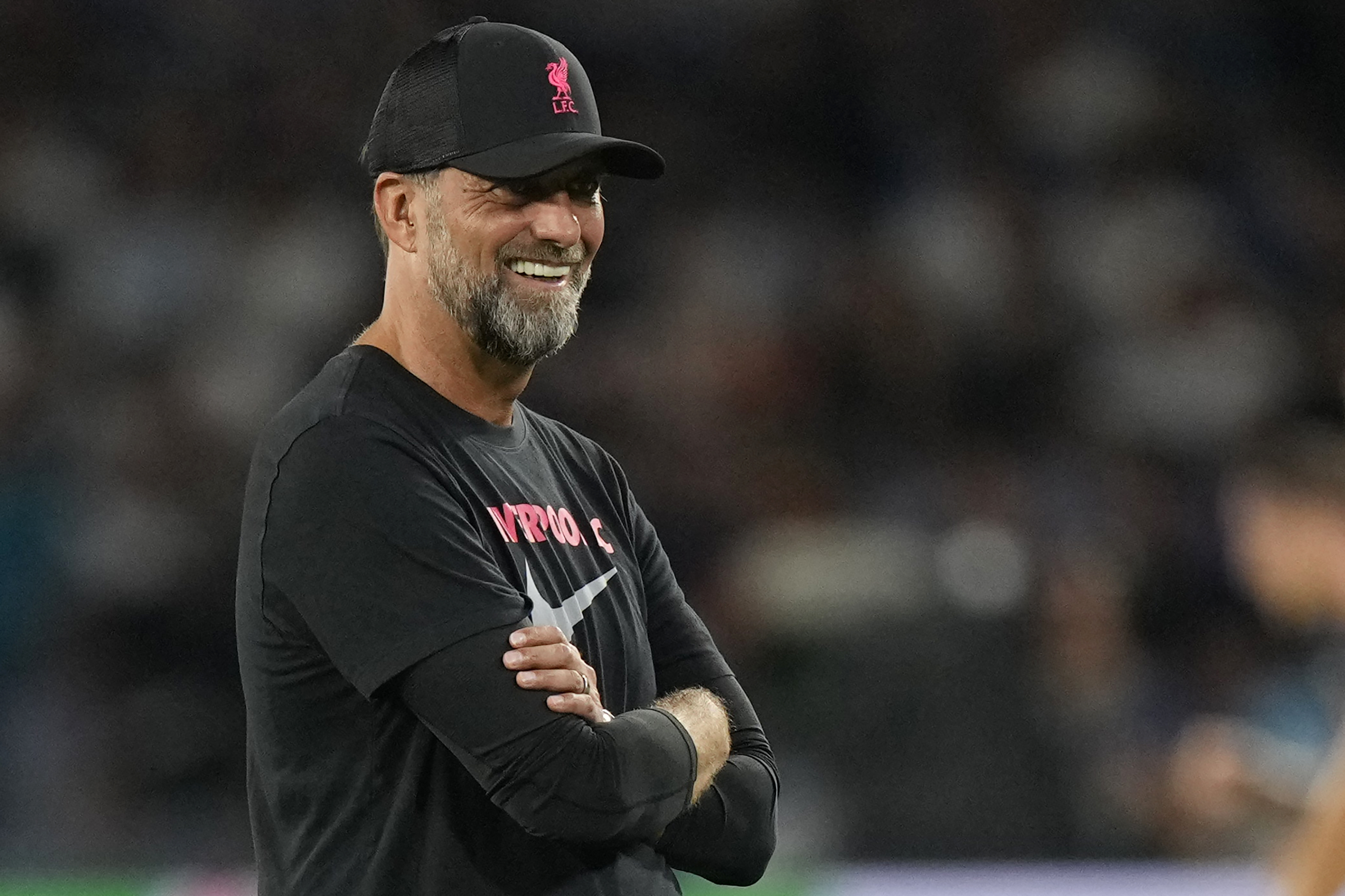 Liverpool's manager Jurgen Klopp smiles during his team's warm up before the group A Champions League soccer match between Napoli and Liverpool at the Diego Armando Maradona stadium in Naples, Italy, Wednesday, Sept. 7, 2022.