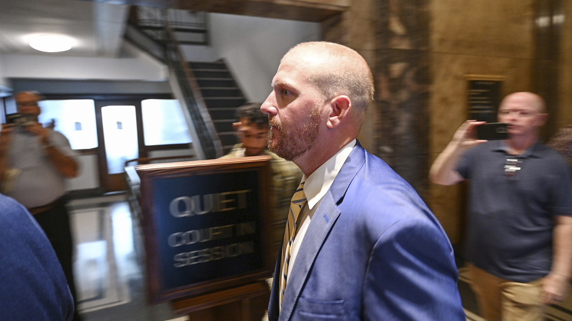 Former Kansas City Chiefs assistant coach Britt Reid walks to a courtroom at the Jackson County Courthouse, Monday, Sept. 12, 2022, in Kansas City, Mo. Reid pleaded guilty to driving while intoxicated resulting in serious physical injury after his truck hit two parked cars in 2021 and severely injured a 5-year-old girl. The son of Chiefs coach Andy Reid was scheduled to go on trial on Sept. 26. 