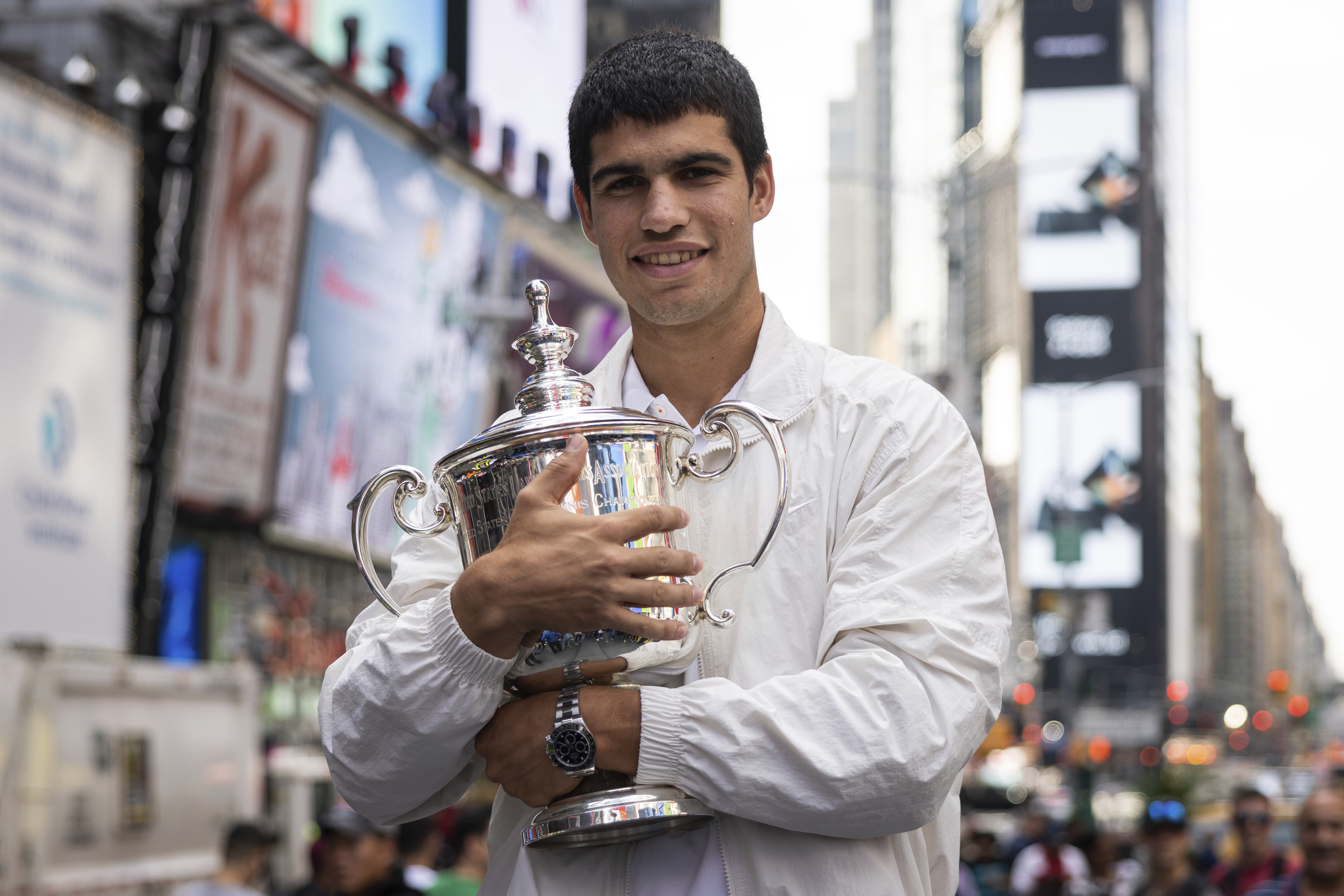 U.S. Open men's singles tennis champion Carlos Alcaraz poses in Times Square, Monday, Sept. 12, 2022, in New York. 
