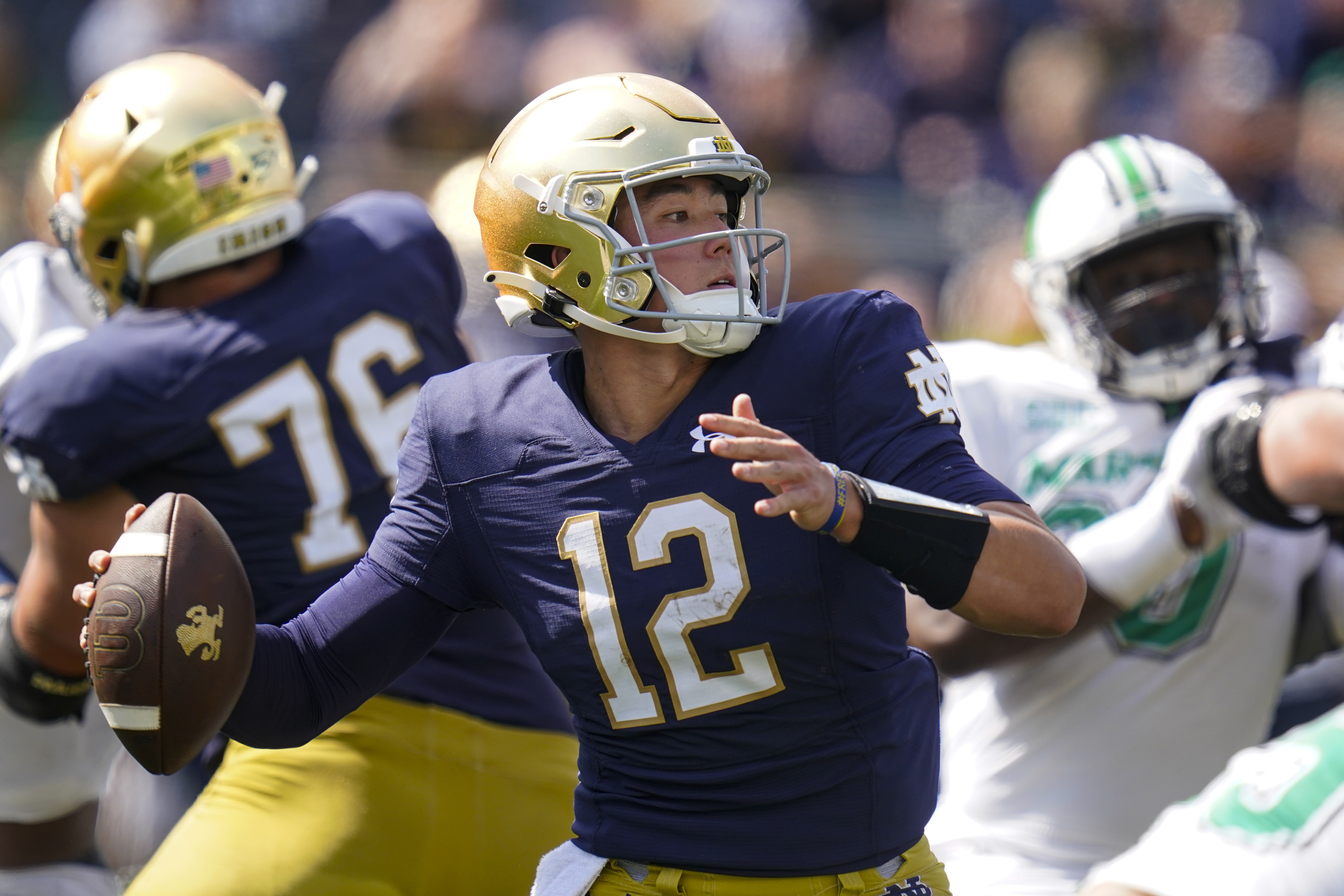 Notre Dame quarterback Tyler Buchner (12) throws against Marshall during the first half of an NCAA college football game in South Bend, Ind., Saturday, Sept. 10, 2022. 