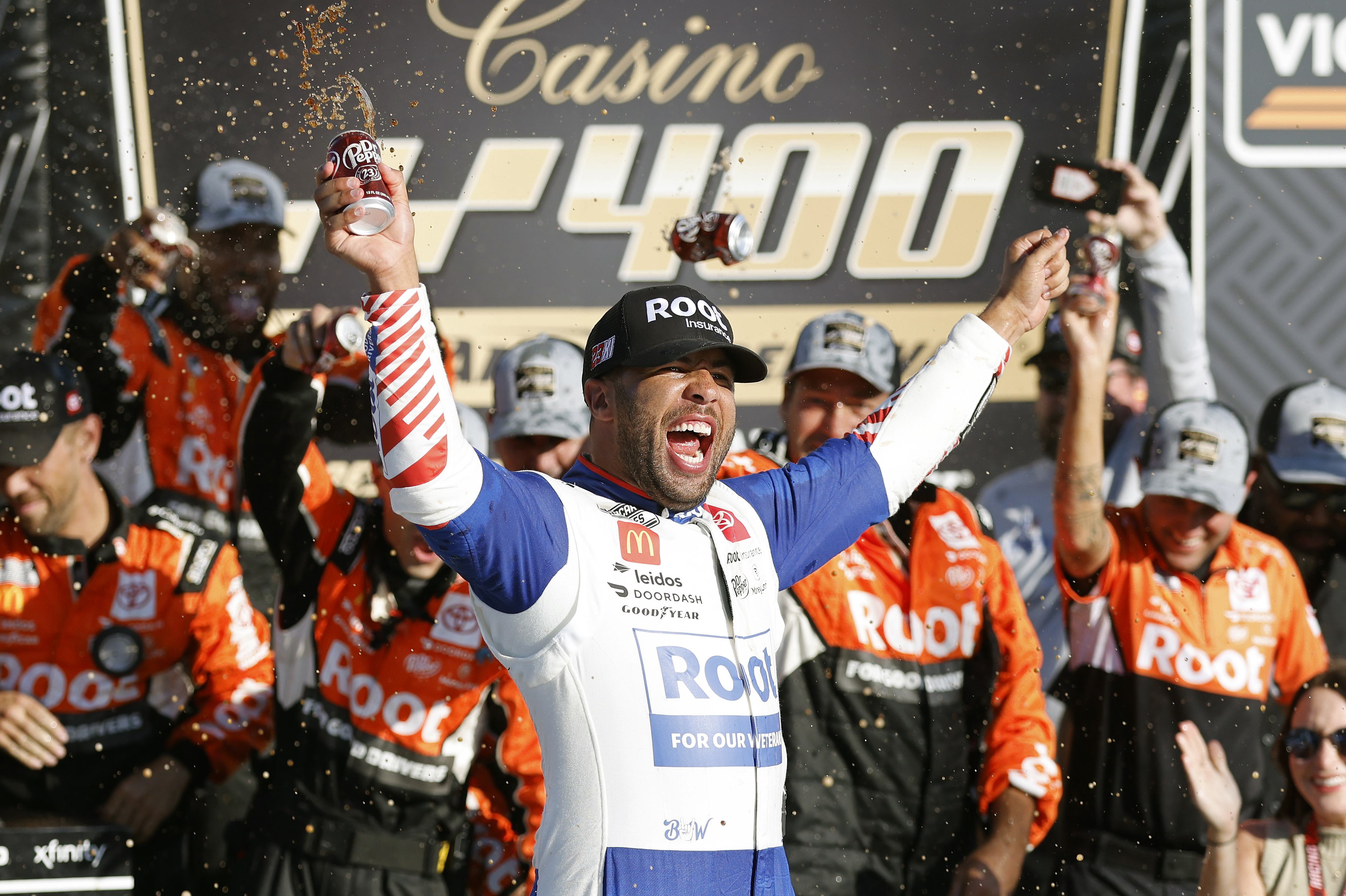 Bubba Wallace celebrates in Victory Lane after winning a NASCAR Cup Series auto race at Kansas Speedway in Kansas City, Kan., Sunday, Sept. 11, 2022. 