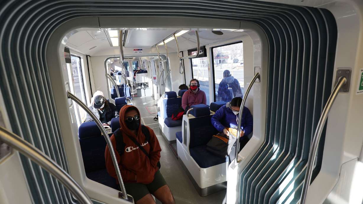 TRAX riders take a train during Free Fare February in Salt Lake City on Feb. 1. The Utah Legislature is reviewing what the costs and benefits are for waiving fare costs forever.