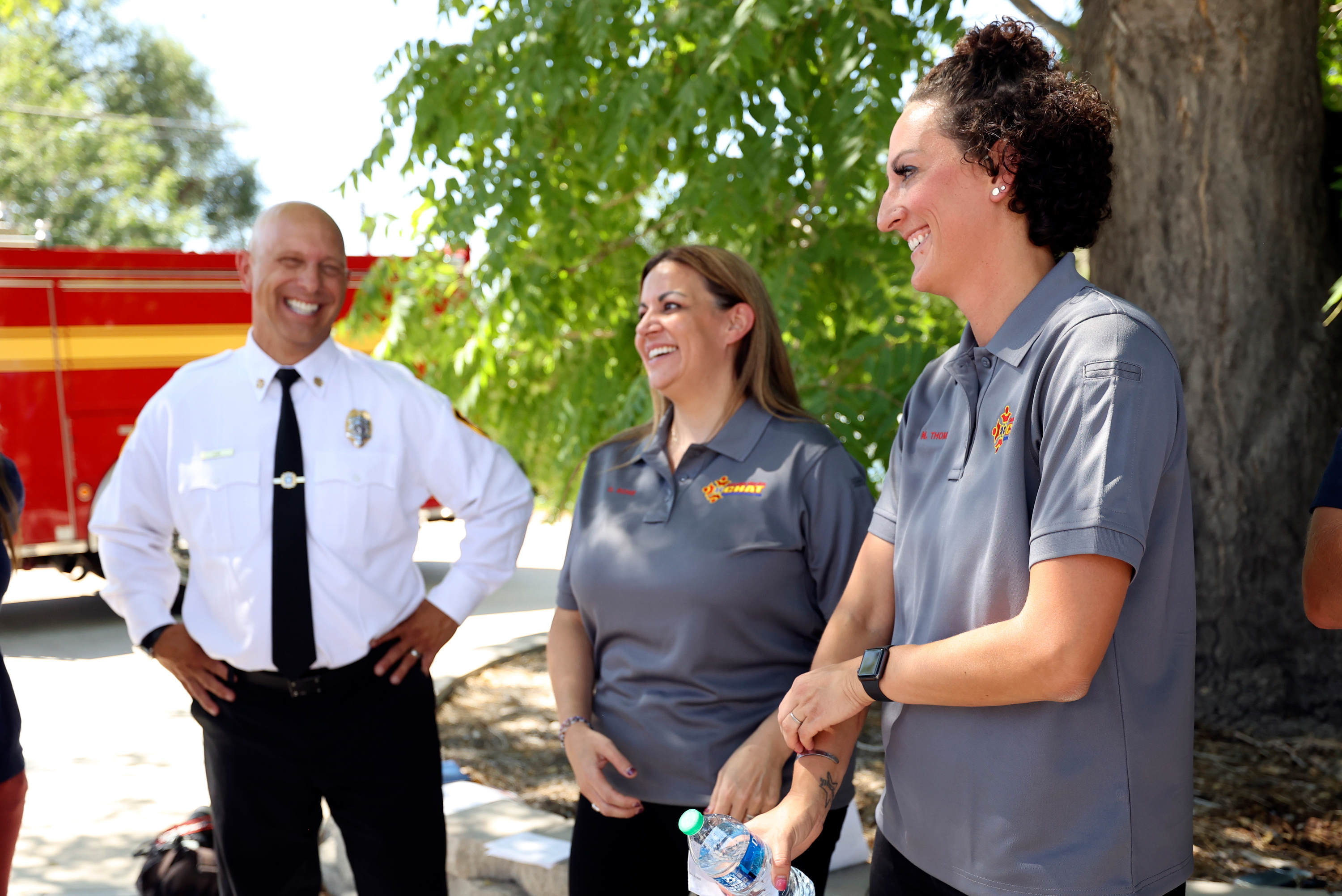 Salt Lake City Fire Chief Karl Lieb, Salt Lake City Fire Community Health Access Team (CHAT) case manager Sarah Bohe and Salt Lake City Fire CHAT program manager and social worker Natasha Thomas talk after a press conference to announce the launch of CHAT, which pairs social workers with paramedics and firefighters to respond to calls involving mental health, substance abuse or any issue that would benefit from a social worker’s response, at Salt Lake Fire Station 6 in Salt Lake City on Aug. 31.