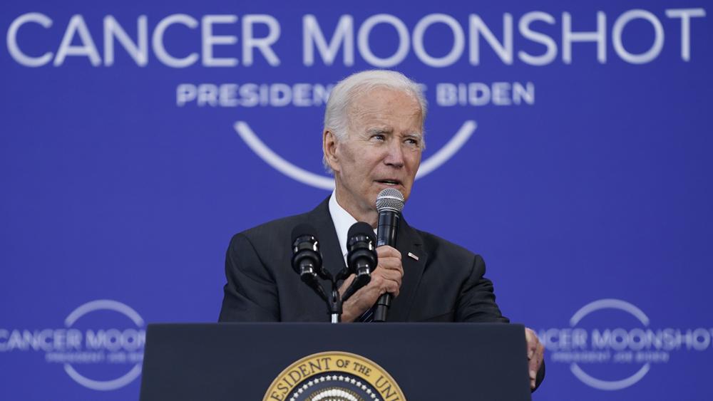 President Joe Biden speaks on the cancer moonshot initiative at the John F. Kennedy Library and Museum, Monday in Boston. Biden on Monday urged Americans to come together for a new "national purpose" — his administration's effort to end cancer "as we know it."