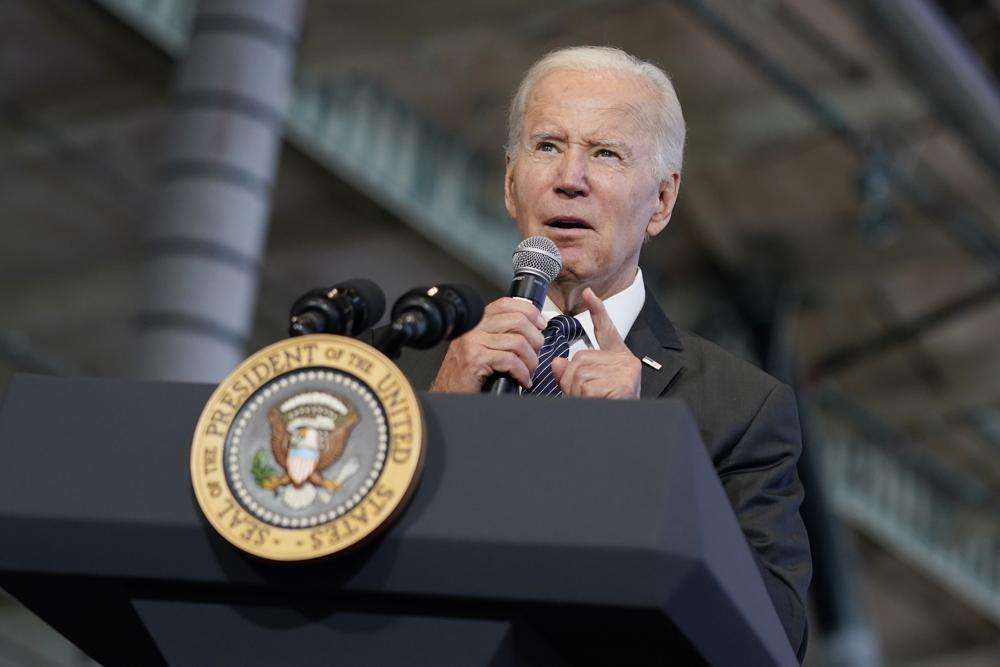 President Joe Biden delivers remarks on the Bipartisan Infrastructure Law at Boston Logan International Airport, Monday in Boston. Biden on Monday urged Americans to come together for a new "national purpose" — his administration's effort to end cancer "as we know it."