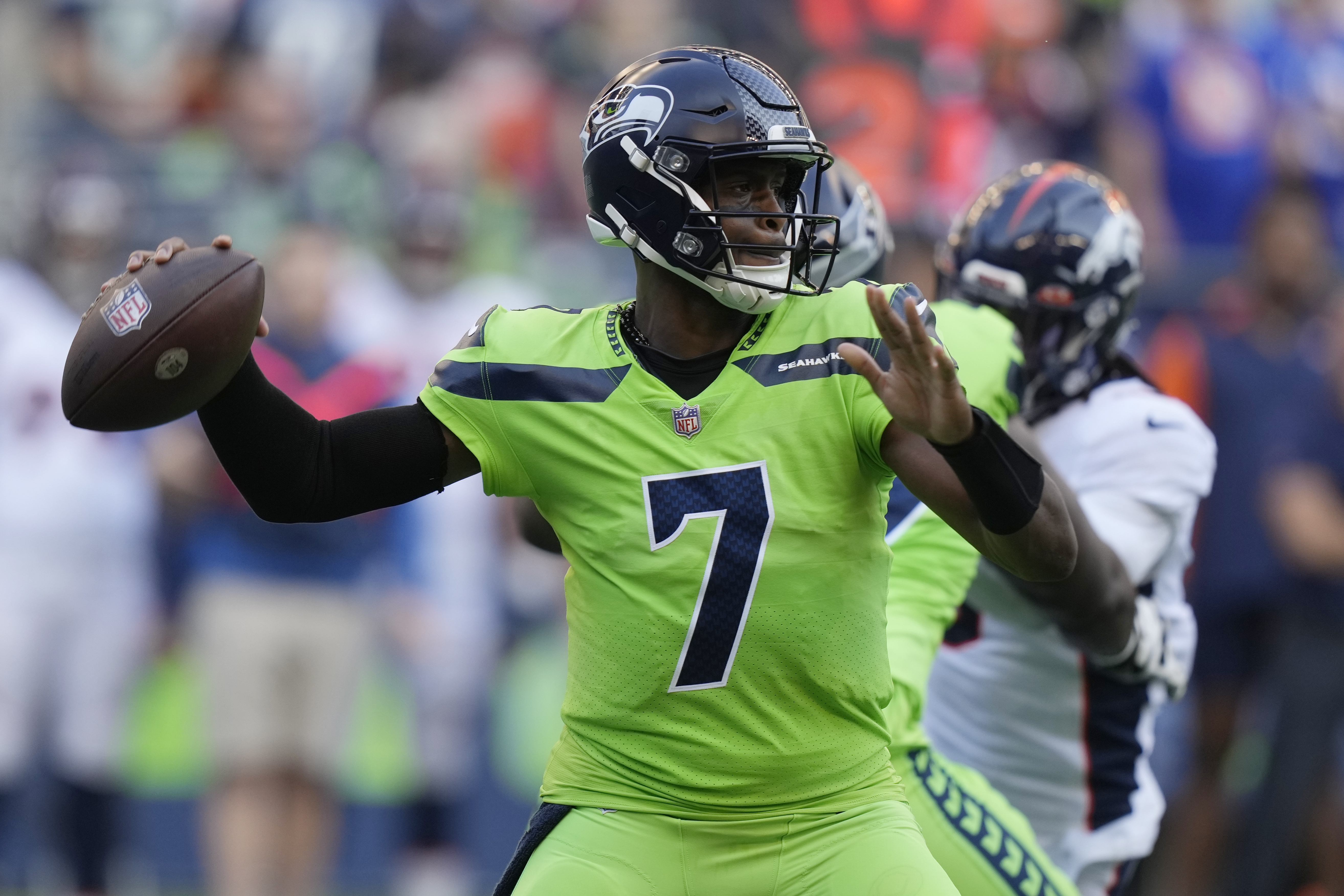 Seattle Seahawks quarterback Geno Smith passes against the Denver Broncos during the first half of an NFL football game, Monday, Sept. 12, 2022, in Seattle.