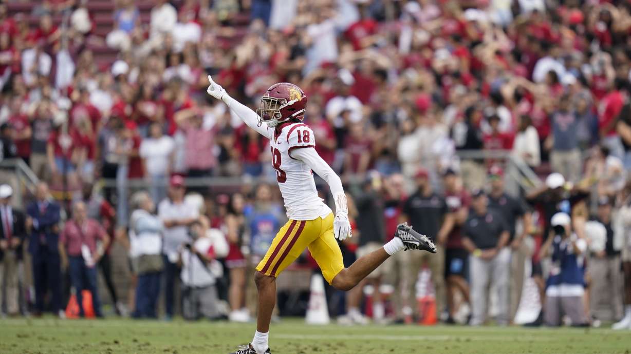 Southern California linebacker Eric Gentry (18) reacts after defensive back Mekhi Blackmon intercepted a pass thrown by Stanford quarterback Tanner McKee during the first half of an NCAA college football game in Stanford, Calif., Saturday, Sept. 10, 2022.