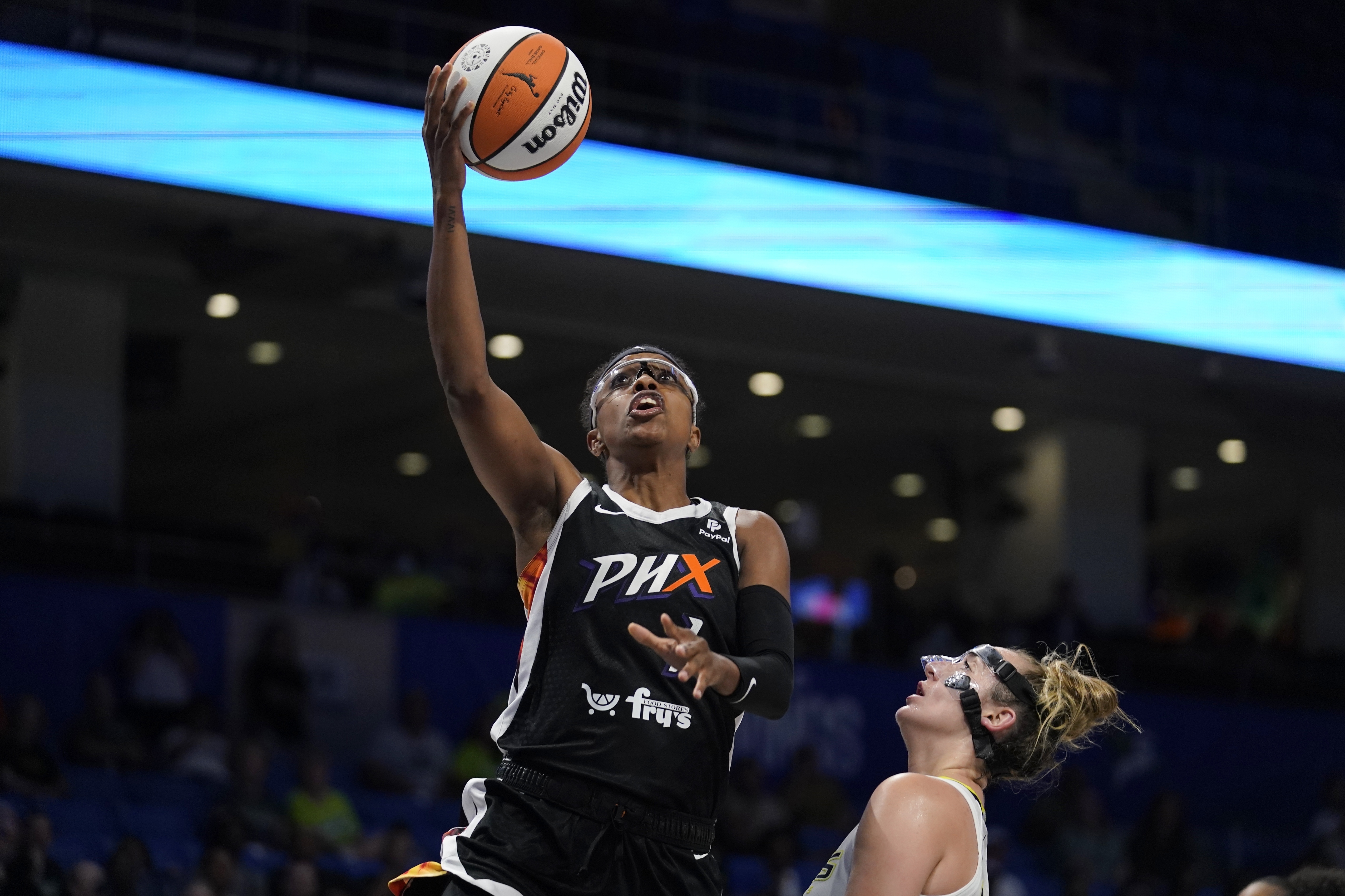 FILE - Phoenix Mercury guard Diamond DeShields shoots next to Dallas Wings guard Marina Mabrey during the second half of a WNBA basketball game, June 17, 2022, in Arlington, Texas. DeShields will be chronicling her journey with USA Basketball as they prep for and play in the FIBA World Cup in Australia. 
