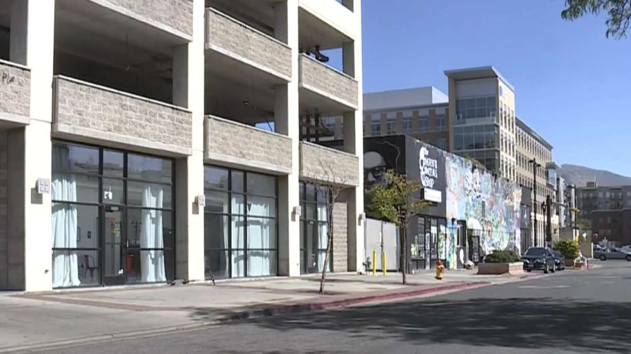 Three men face charges tying them to the shooting and killing of a man inside the Exchange Place parking structure in downtown Salt Lake City in 2018, but none is charged with murder.