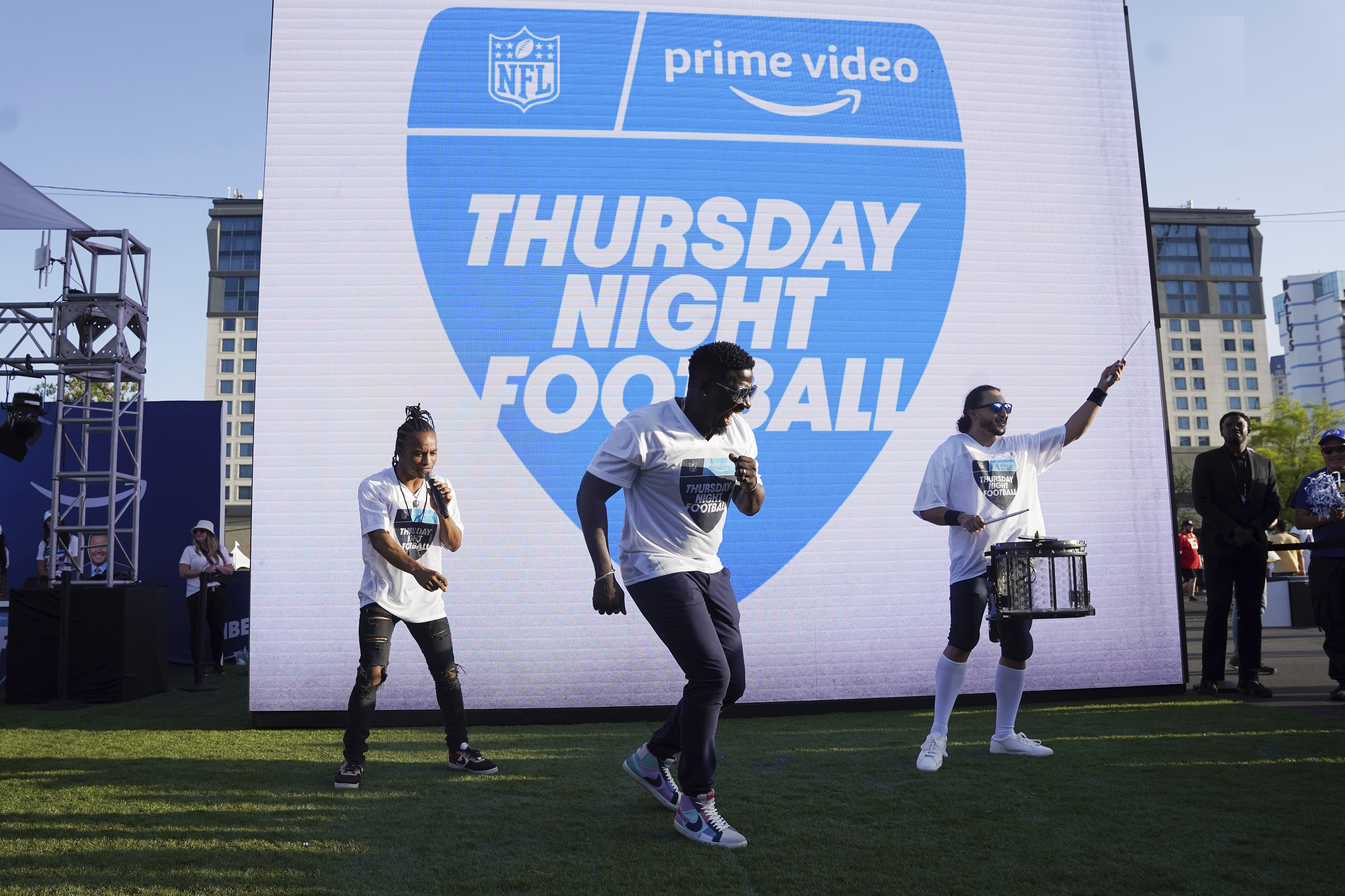 FILE - Robert "Bojo" Ackah, center, and Fik-Shun, left, perform during the announcement of the first Thursday Night Football on Prime Video matchup featuring the San Diego Chargers at Kansas City Chiefs at the 2022 NFL Draft on Thursday, April 28, 2022 in Las Vegas. The Thursday night, Sept. 15 game between the Los Angeles Chargers and Kansas City Chiefs kicks off Amazon Prime Video's 11-year agreement with the NFL to carry “Thursday Night Football".