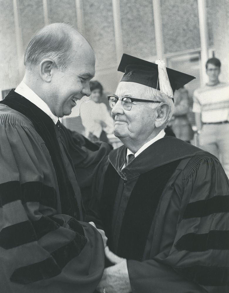 BYU President Dallin Oaks, left, shakes hands and hugs President Spencer W. Kimball, president of The Church of Jesus Christ of Latter-day Saints, during a campus event in the 1970s.
