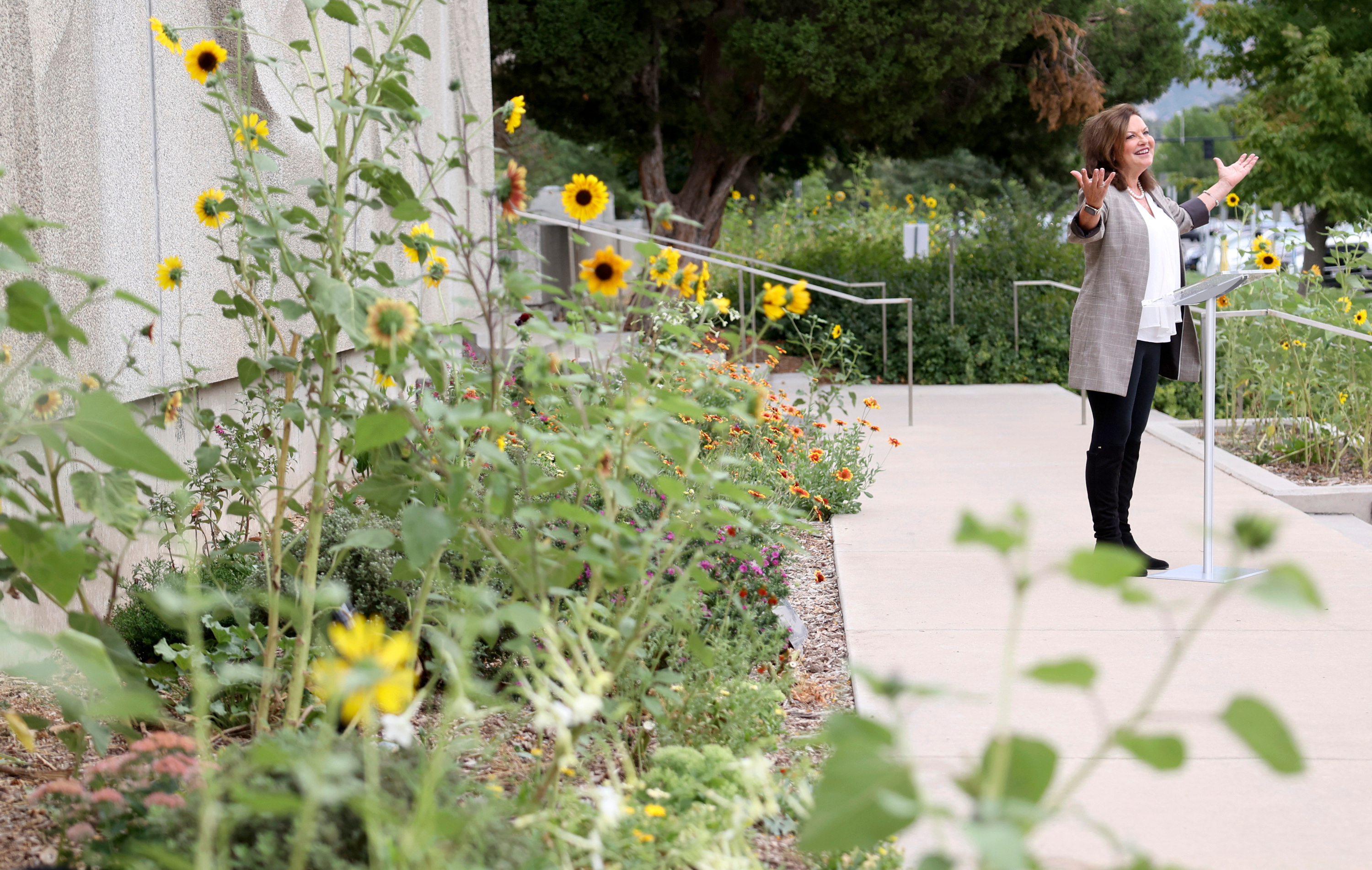 Heidi Kuhn, Roots of Peace founder, speaks during an unveiling ceremony for The Leonardo Peace Garden in Salt Lake City on Tuesday.