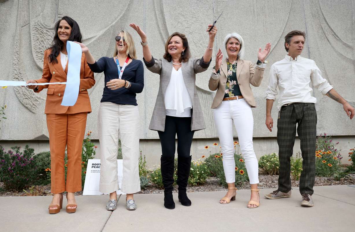 Holly Sweeten, Roots of Peace ambassador, left, Alexandra Hesse, The Leonardo executive director, Heidi Kuhn, Roots of Peace founder, Missy Larsen, DoTerra International philanthropy and community impact vice president, and Heath Brodie, Leonardo head fabricator, participate in a ribbon-cutting ceremony for The Leonardo Peace Garden in Salt Lake City on Tuesday.