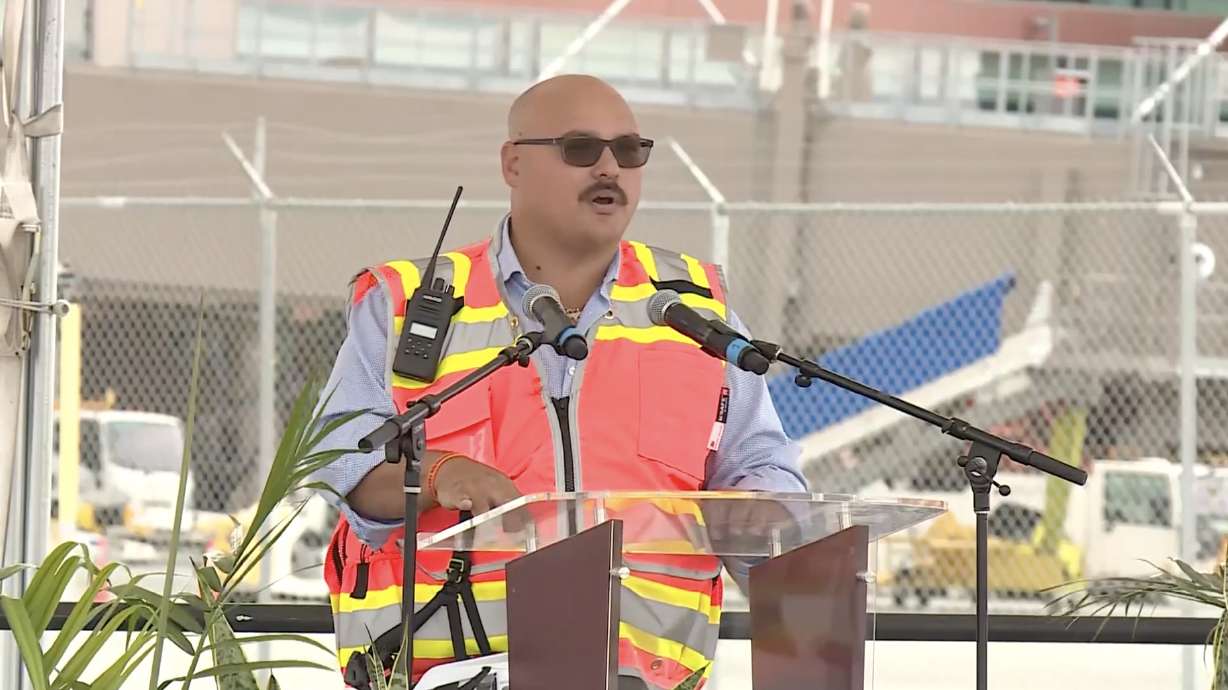 Sebastiano Cardella, the senior superintendent of the Holder-Big D joint construction venture, speaks at a ceremony Tuesday morning celebrating the two-year anniversary of the new airport. The airport is planning to add more gates in the near future.