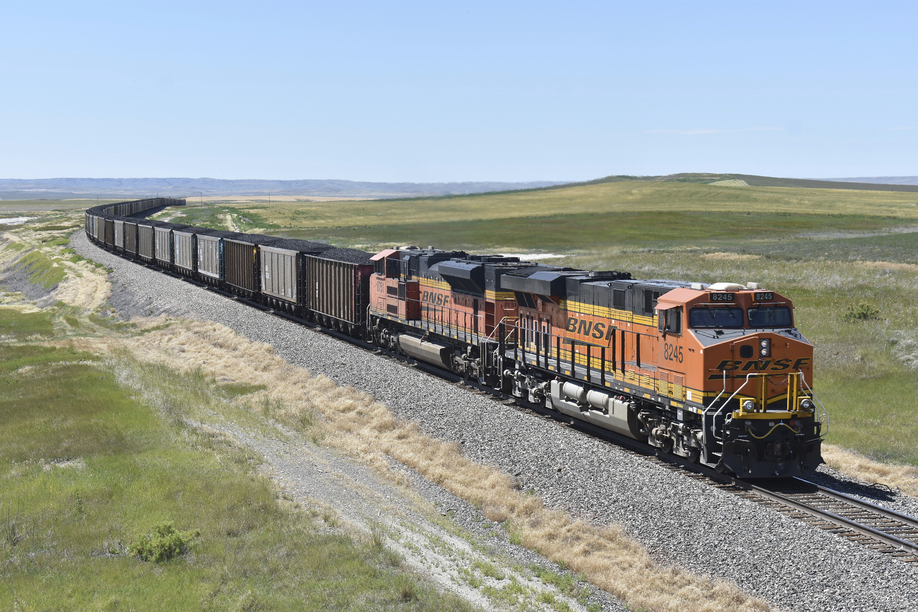 A BNSF railroad train hauling carloads of coal from the Powder River Basin of Montana and Wyoming is seen east of Hardin, Mont., on July 15, 2020. Business and top officials are bracing for the possibility of a nationwide rail strike on Friday while talks continue between the nation's largest freight railroads and their unions. 
