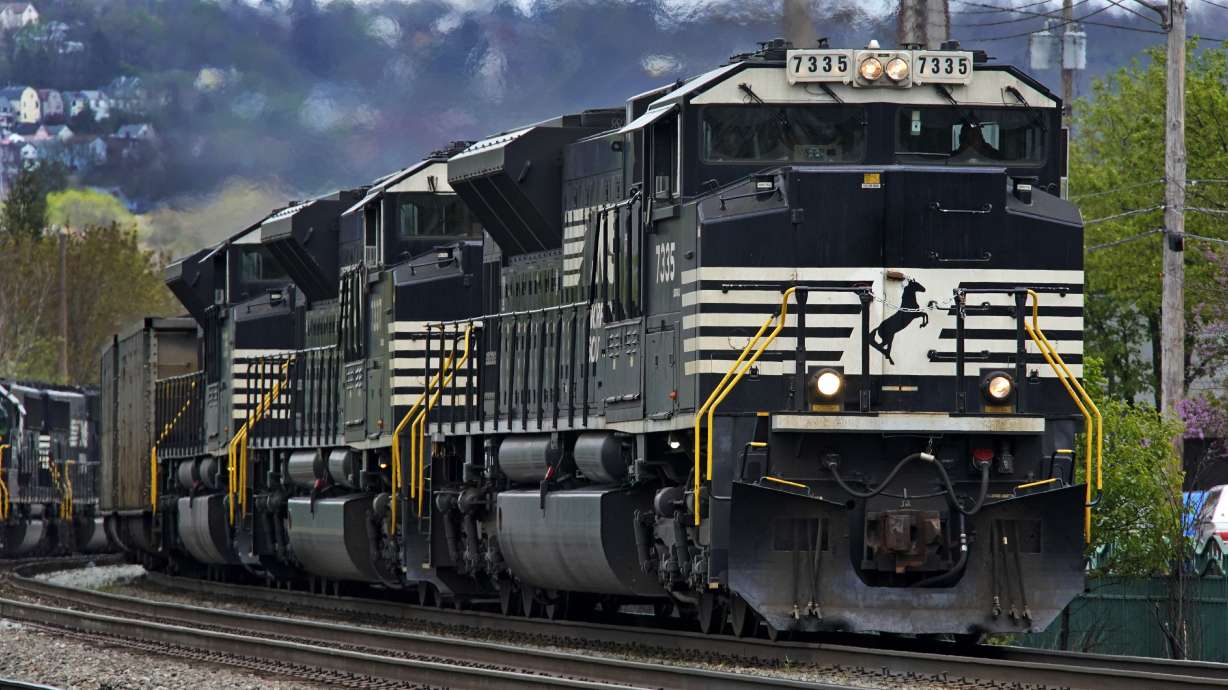 A Norfolk Southern freight train makes its way through Homestead, Pa., on April 27. Business and top officials are bracing for the possibility of a nationwide rail strike Friday while talks continue between the nation's largest freight railroads and their unions.