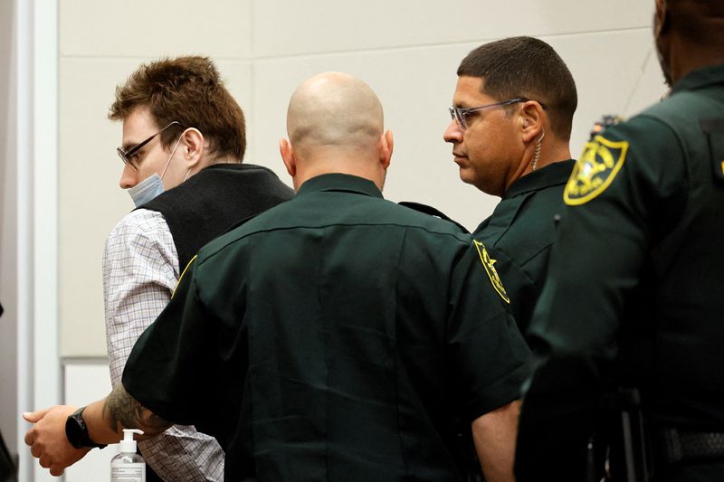 Marjory Stoneman Douglas High School shooter Nikolas Cruz is escorted from the courtroom during the penalty phase of Cruz's trial at the Broward County Courthouse in Fort Lauderdale, Fla., Aug. 25. Defense lawyers for Cruz, who murdered 17 people in February 2018, abruptly rested their case on Wednesday, taking prosecutors by surprise and drawing an angry rebuke from the trial judge.