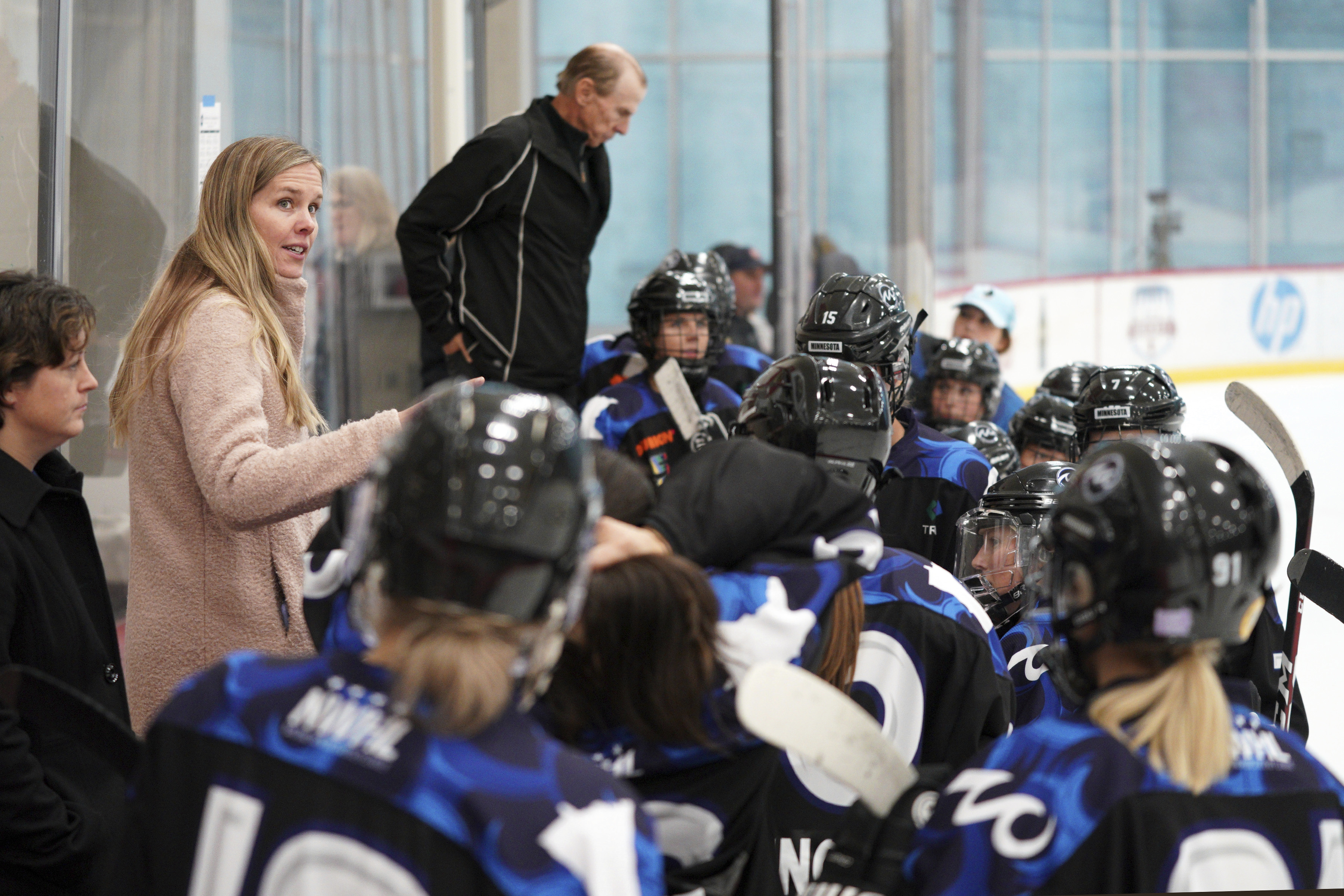 Minnesota Whitecaps coach Ronda Engelhardt talks with players on the bench during a hockey game against the Metropolitan Riveters in St. Paul, Minn., Saturday, Oct. 12, 2019. The Nashville Predators have hired their first female scout with Ronda Engelhardt as a North American amateur scout based out of Minnesota. The Predators announced a handful of changes on their hockey operations staff Wednesday, Sept. 14, 2022.  