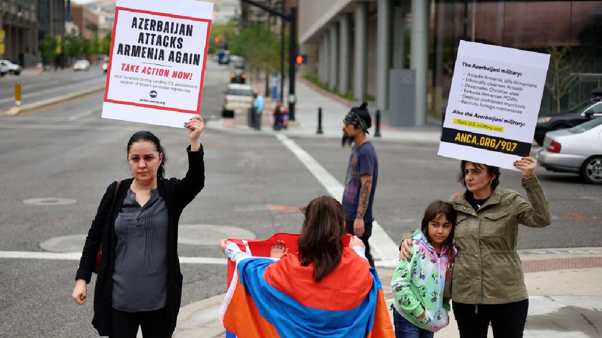 Margarita Hakobyan, left, of Midvale, protests Azerbaijani attacks on Armenia with members of the Armenian community outside the Wallace F. Bennett Federal Building in Salt Lake City on Wednesday.